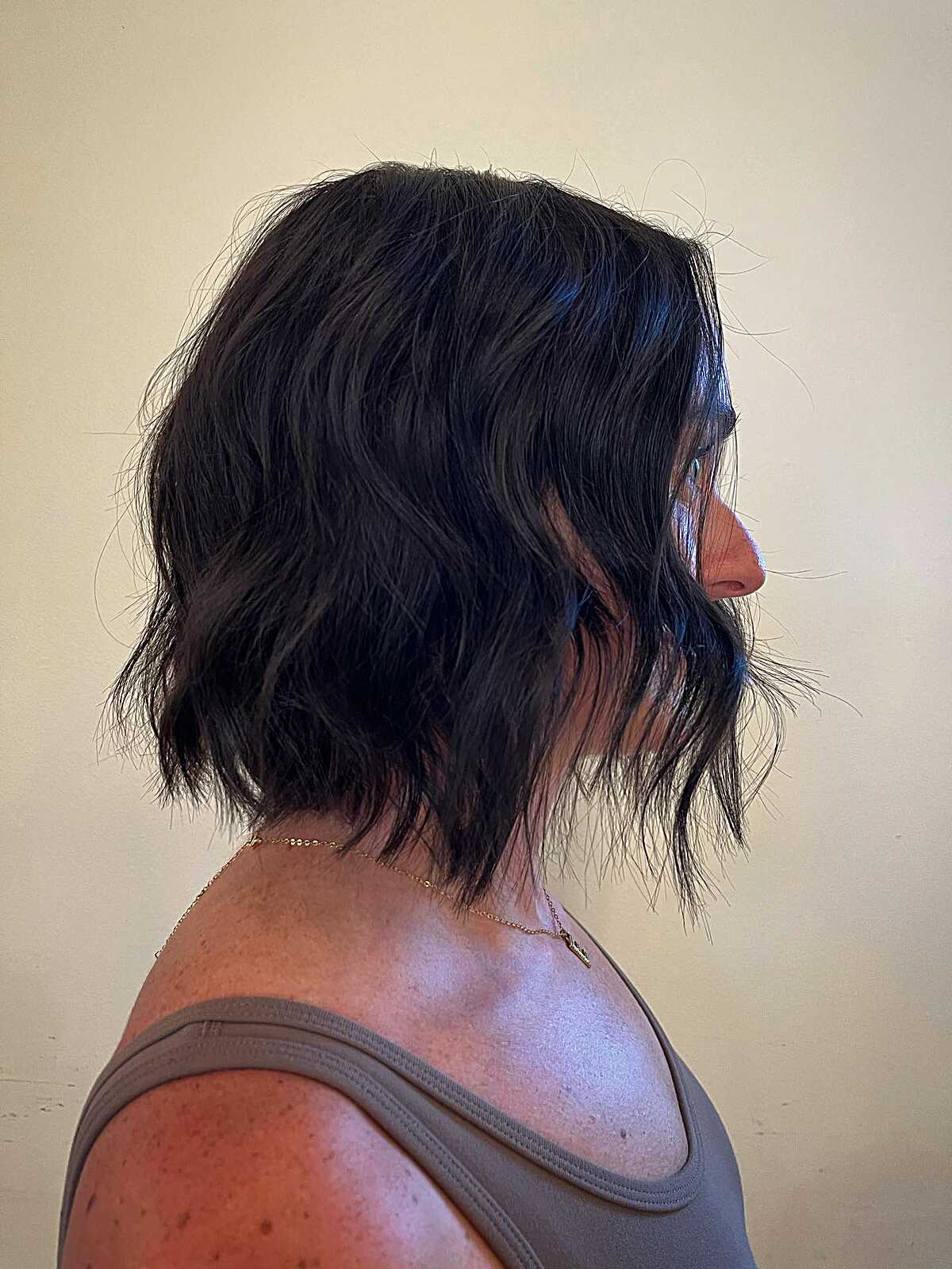 Dark black wavy textured bob with choppy ends