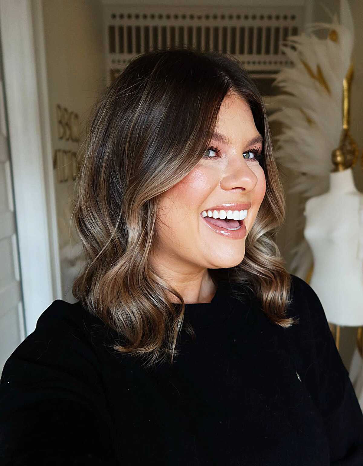 Dark brunette lob with caramel balayage and loose waves