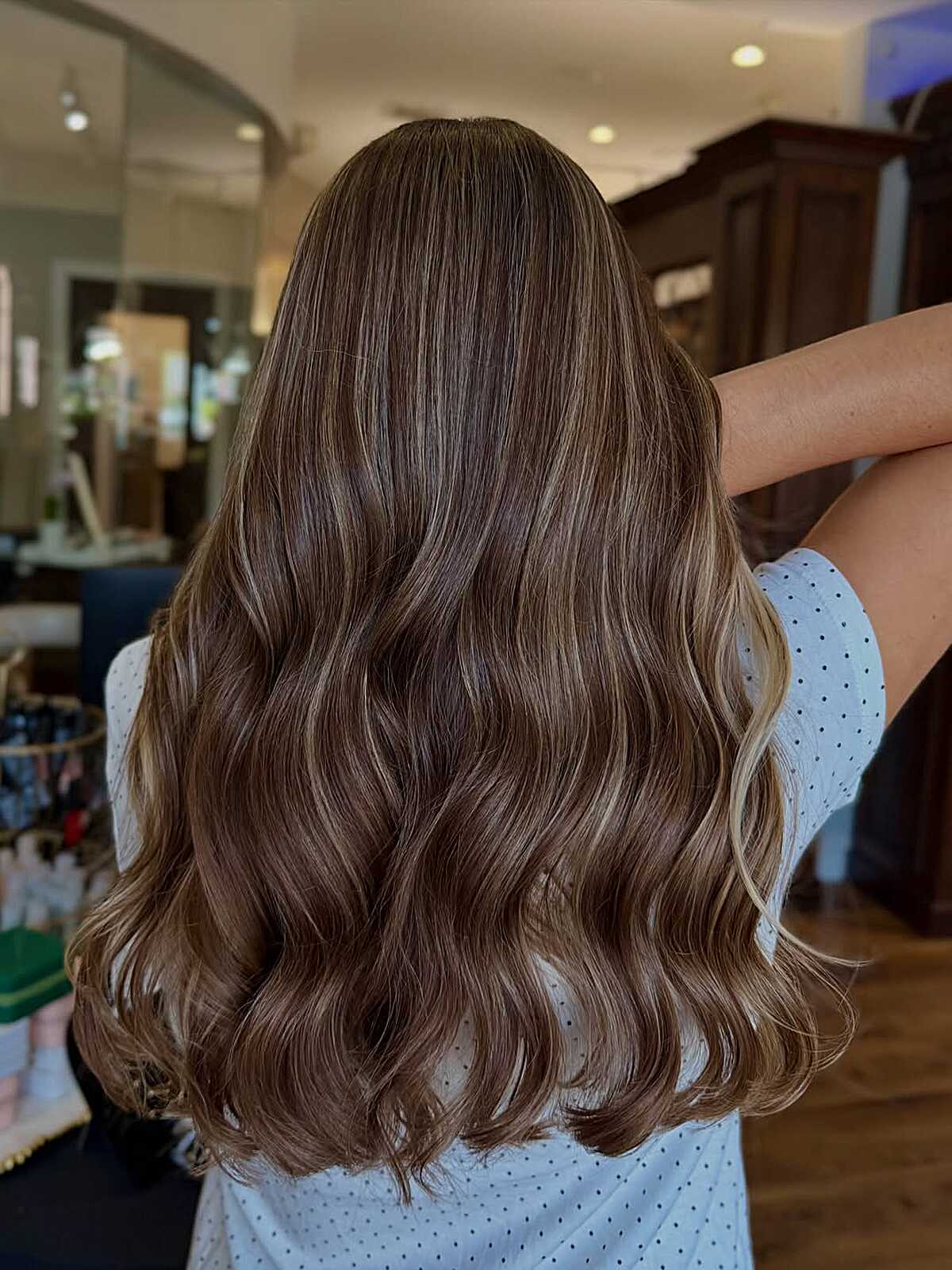Glossy medium brunette with very soft balayage waves