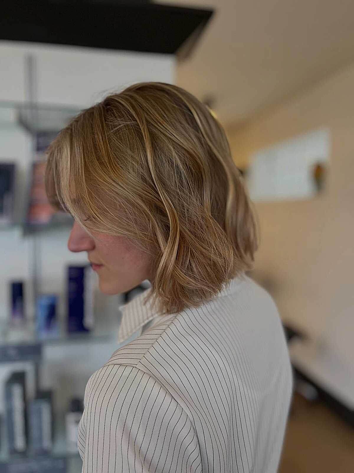 Honey blonde bob with shaggy layers and soft waves