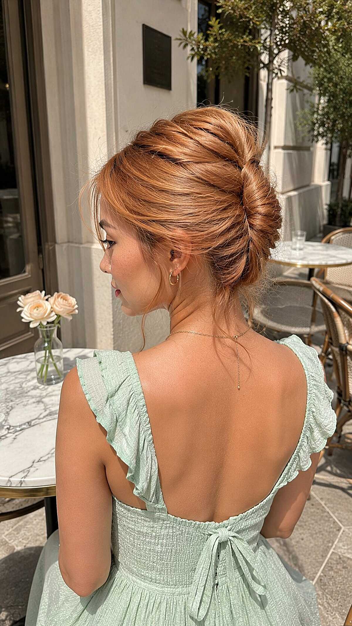Messy French twist updo on copper red hair