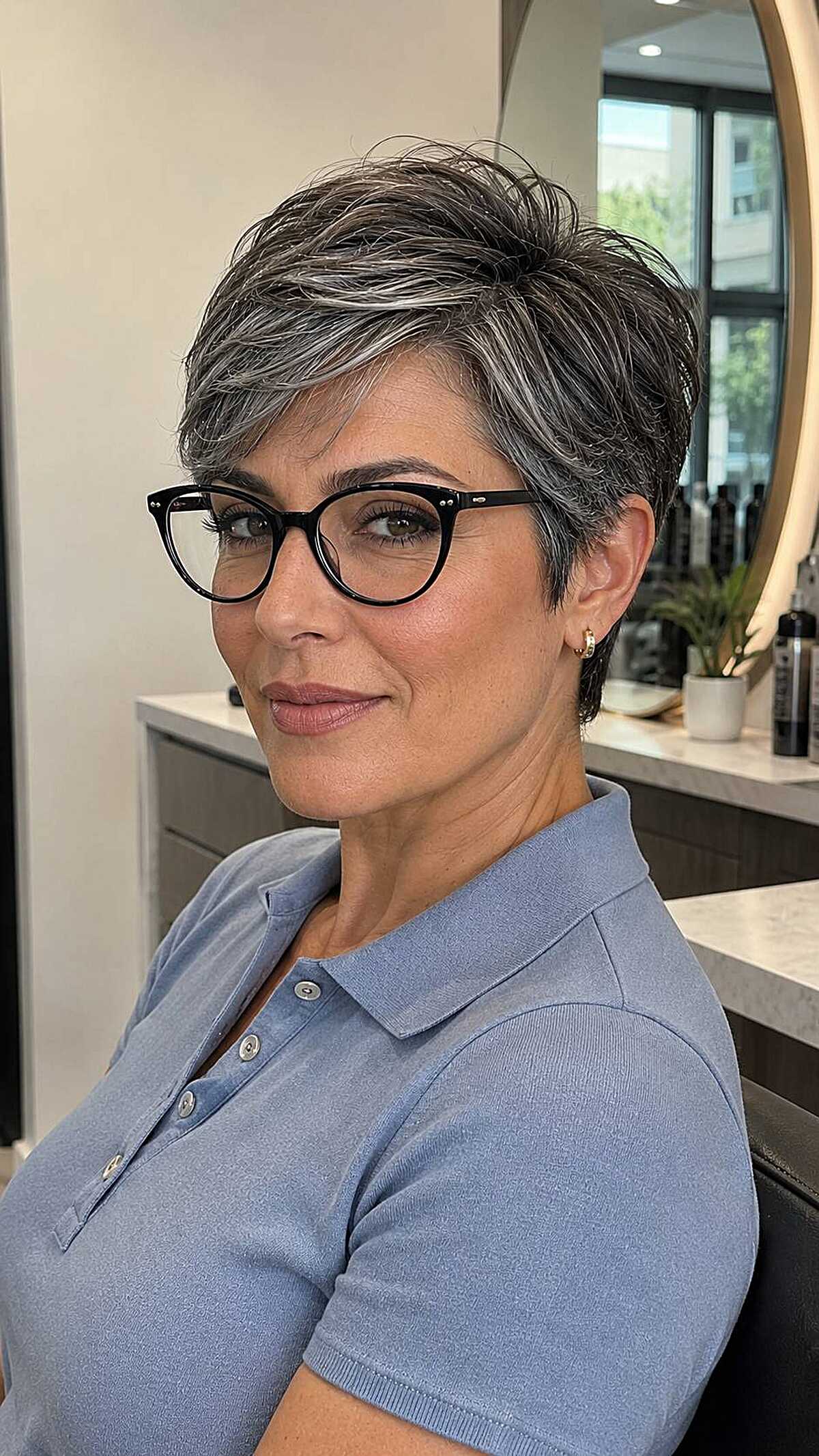 Salt and pepper short pixie with black cat-eye frames