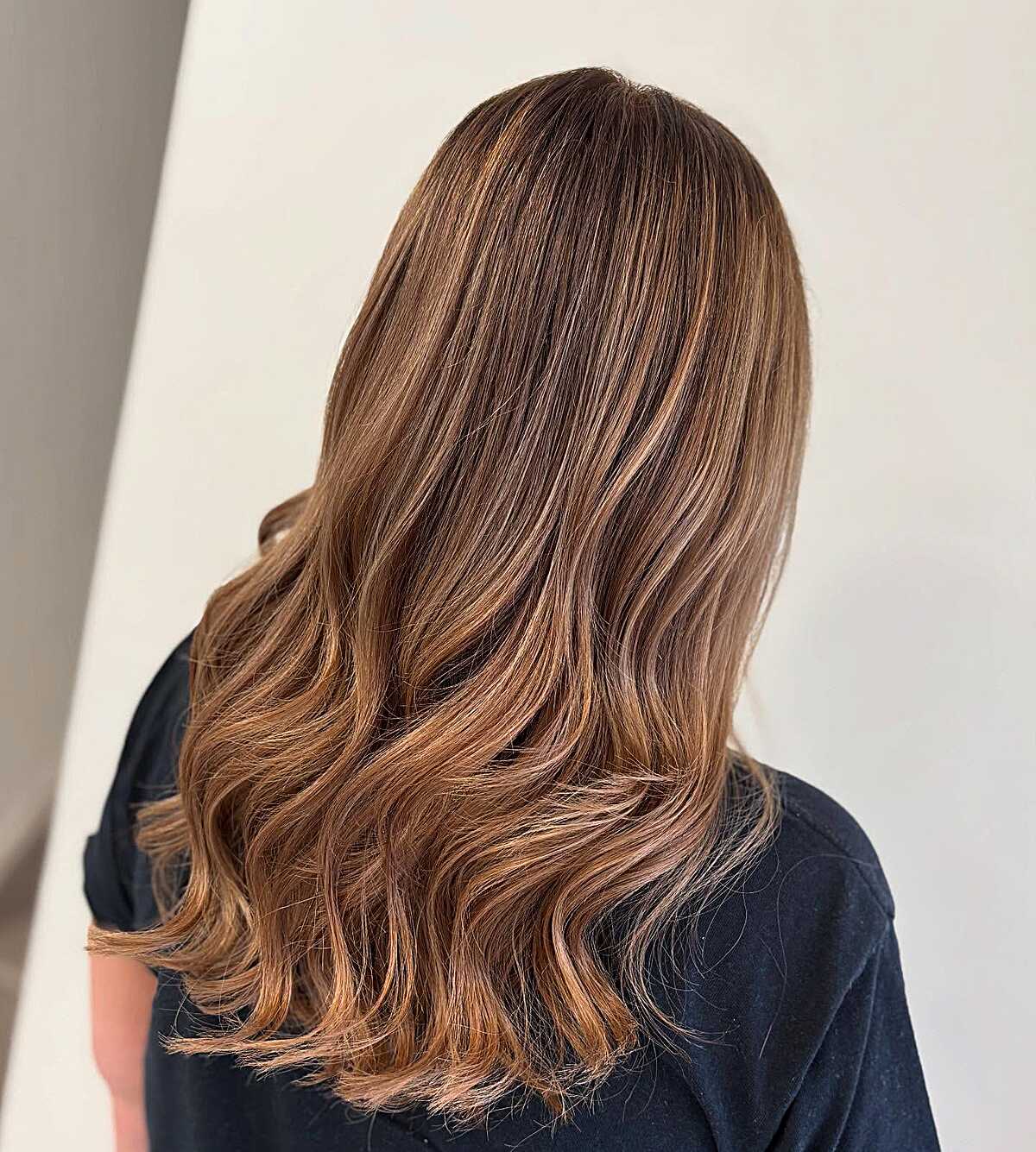 Medium brunette with soft pecan-toned balayage waves
