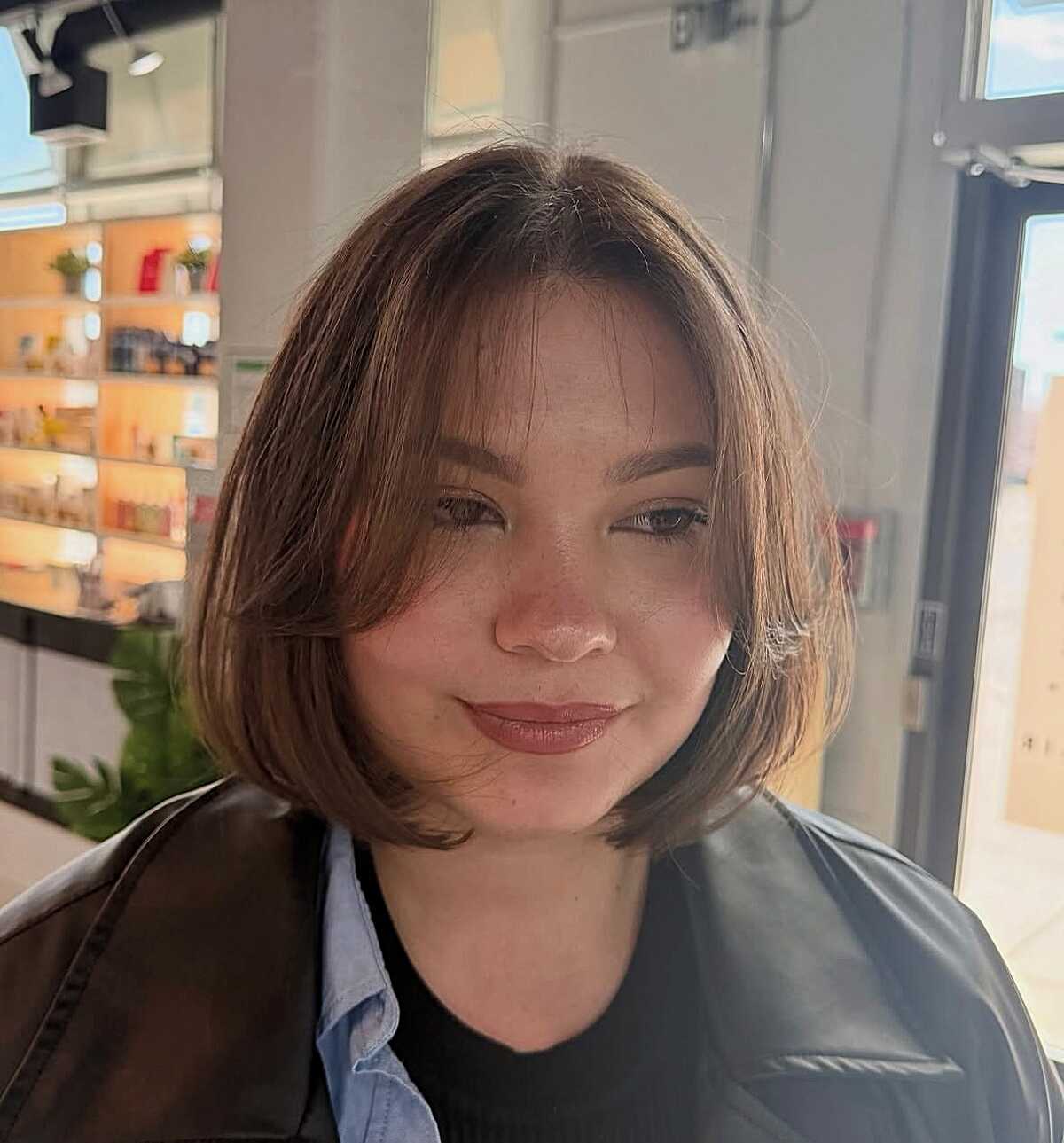 Soft rounded chestnut brown chin-length bob