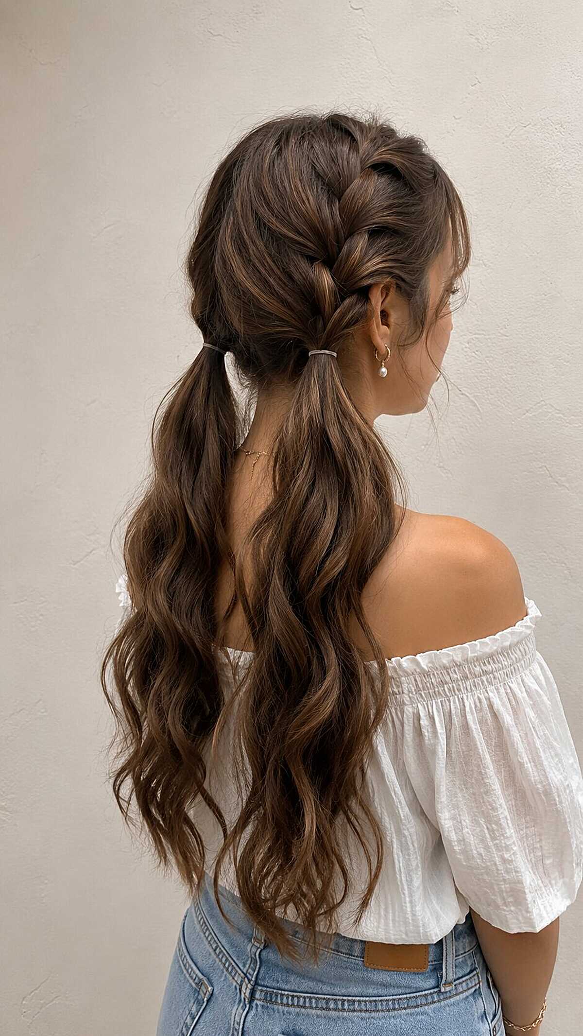 Twisted half-up low pigtails with long wavy brunette hair