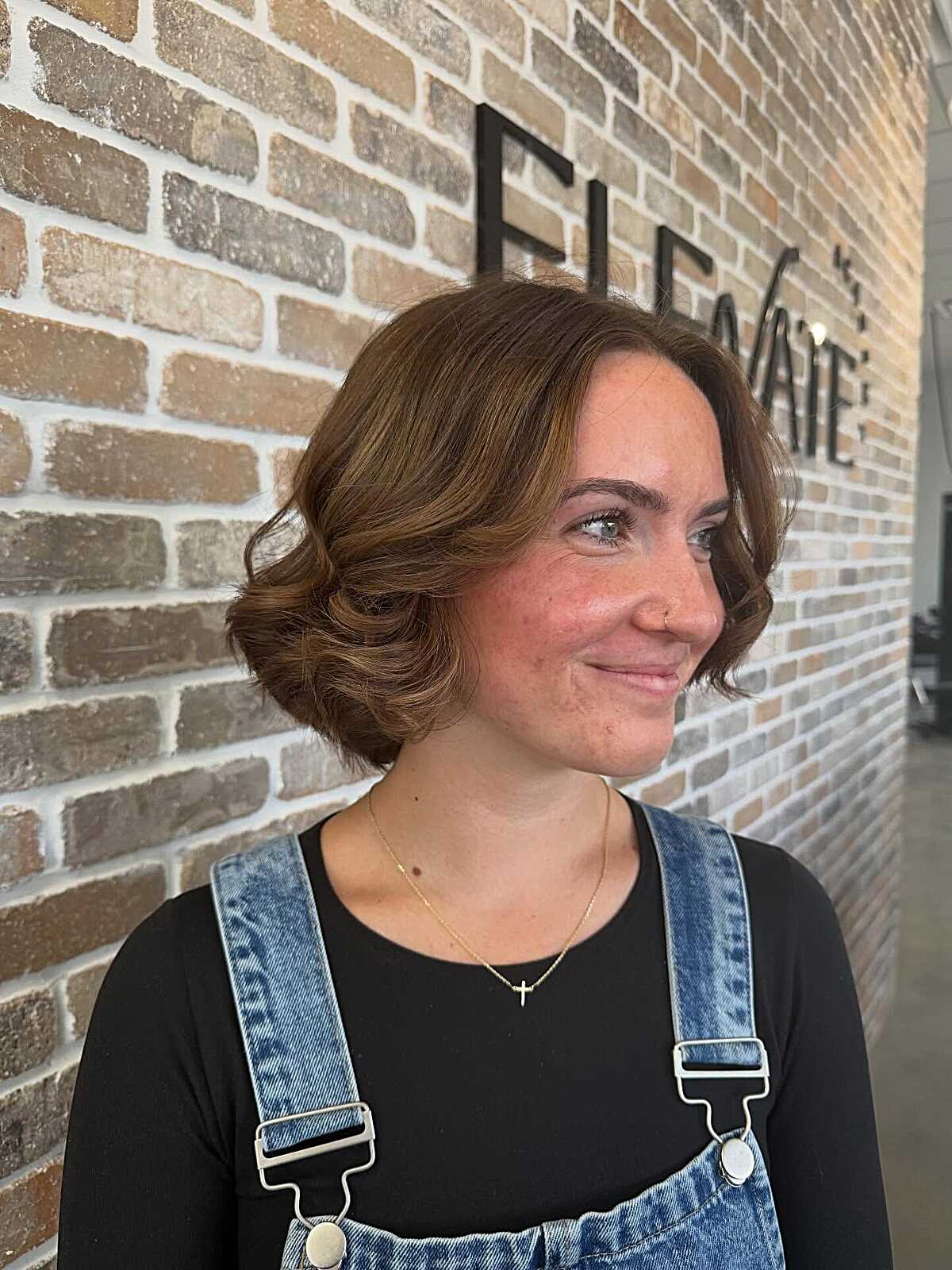 Warm brown chin-length bob with vintage roller curls
