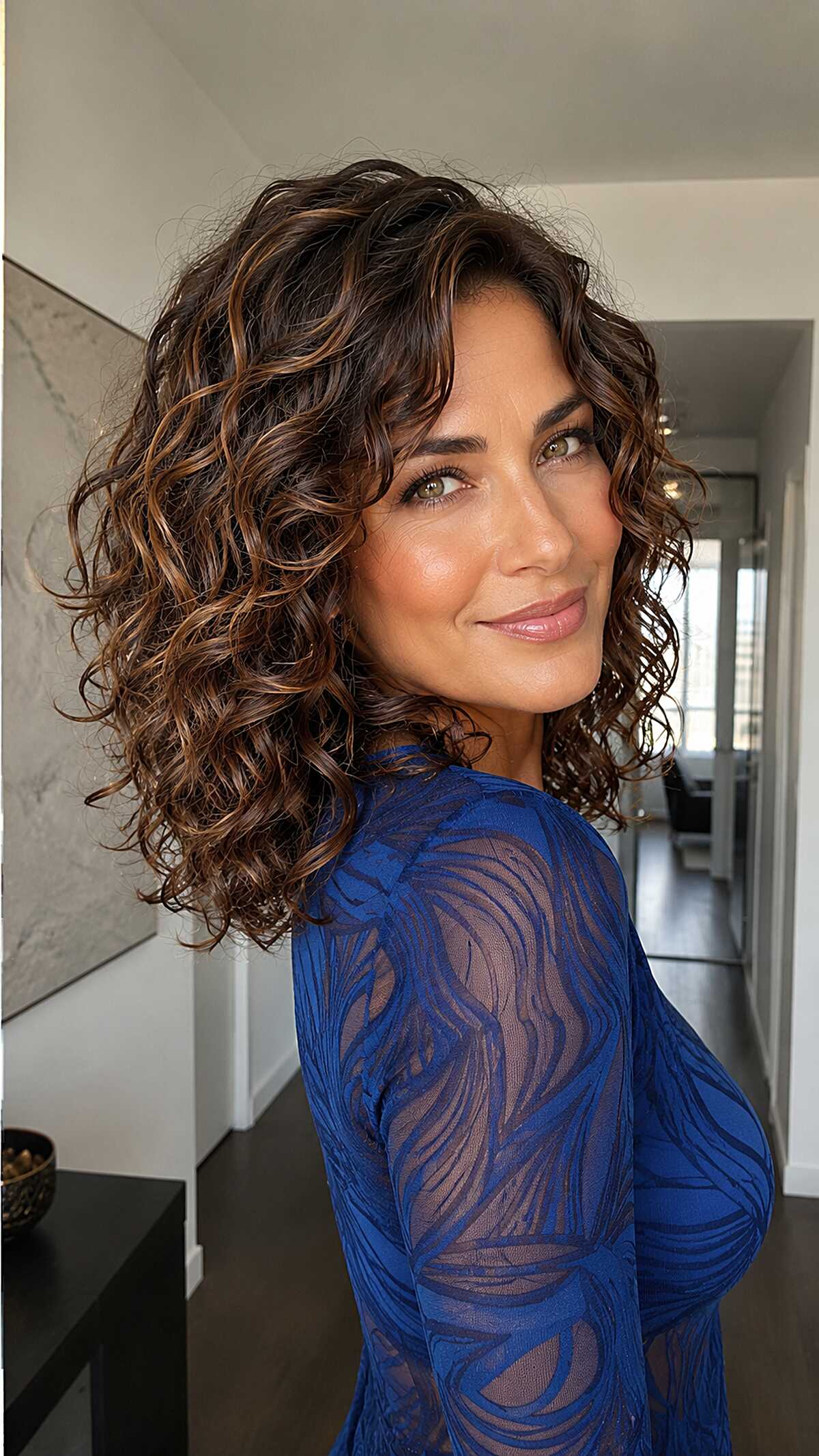 Warm Caramel Balayage on a Collarbone Curly Bob