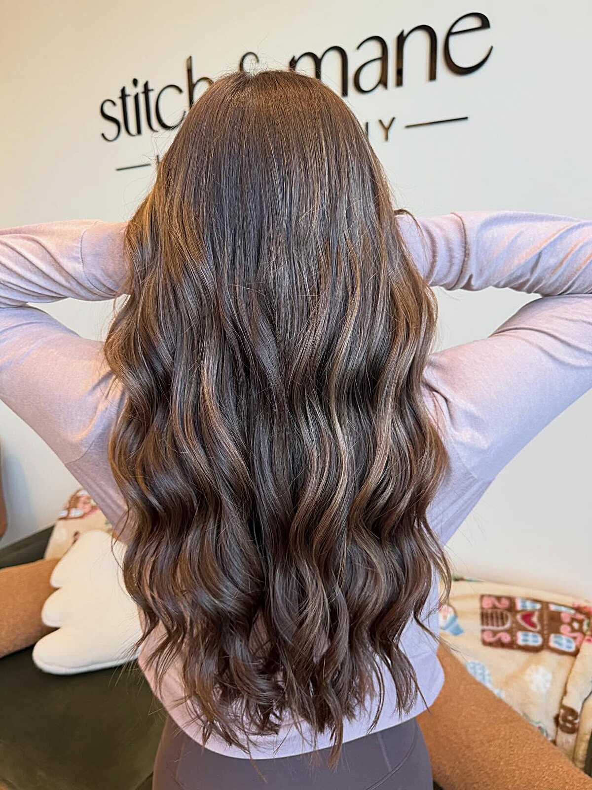 Long dark espresso brunette with warm sun-touched balayage
