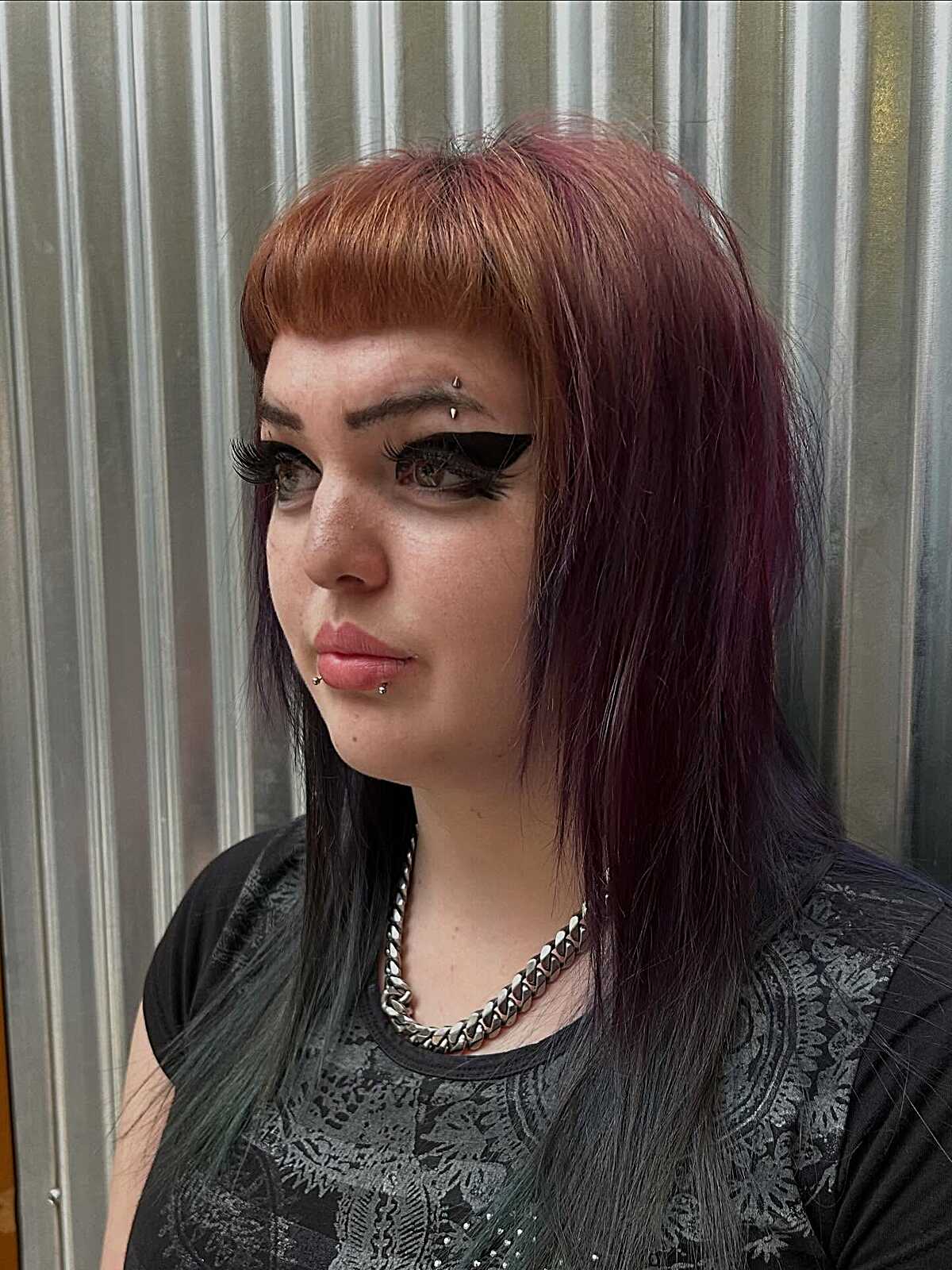 Copper to plum gradient hair with thick micro bangs