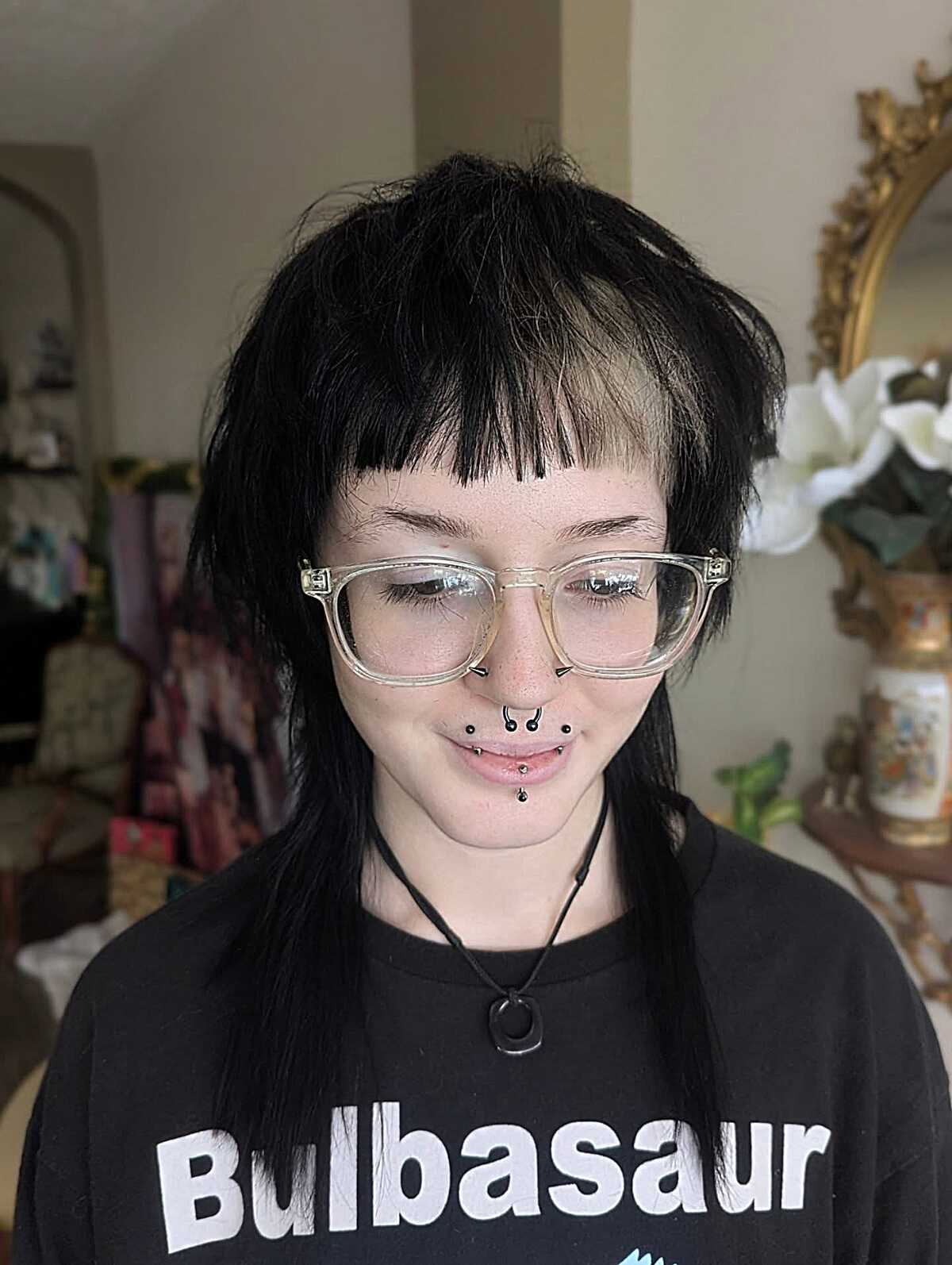 Black jellyfish cut with wispy micro bangs and glasses