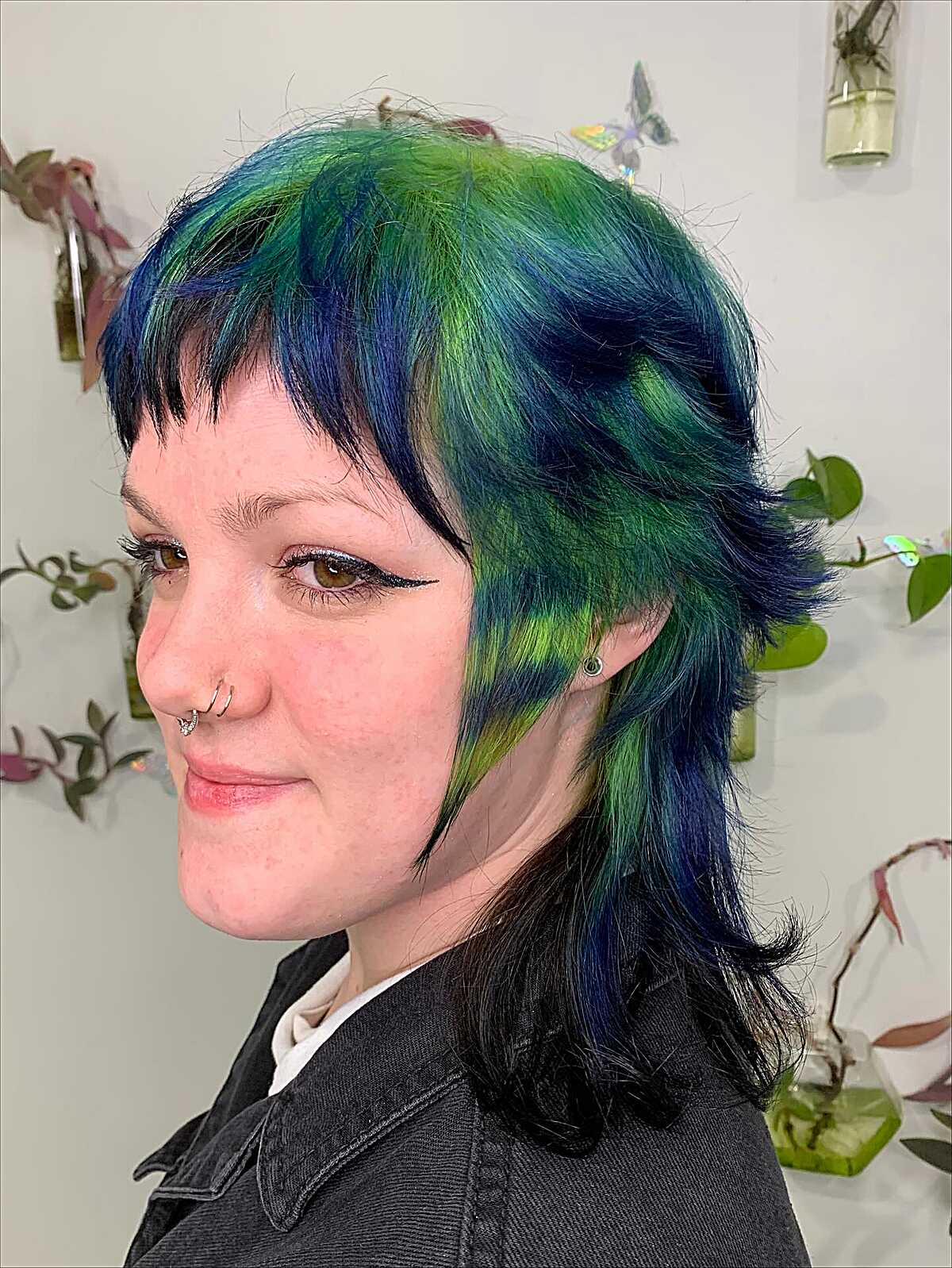 Blue-green shag cut with choppy micro bangs