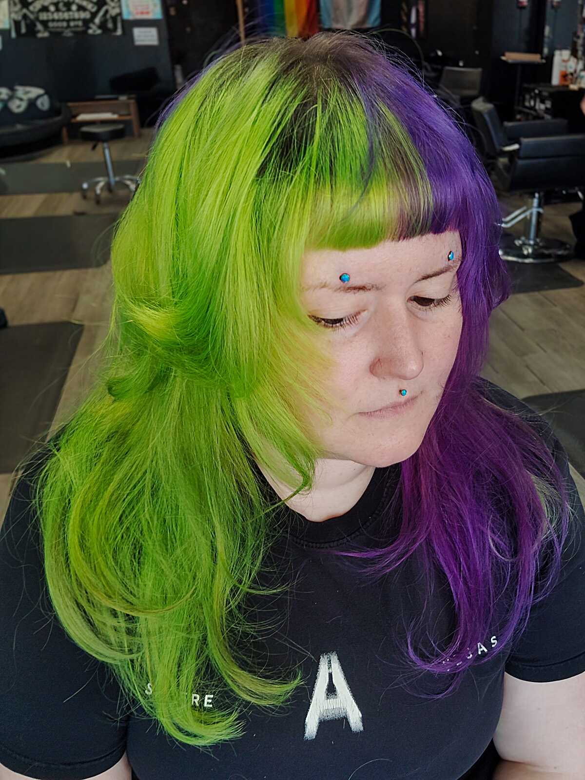 Neon green and purple split dye with short full bangs
