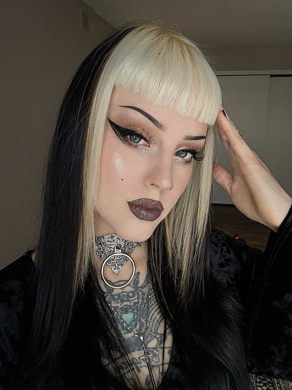 Platinum blonde and black split hair with blunt bangs