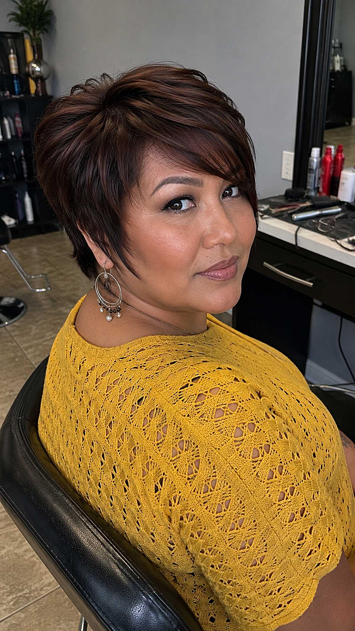 Rich Auburn Layered Pixie with Side-Swept Fringe