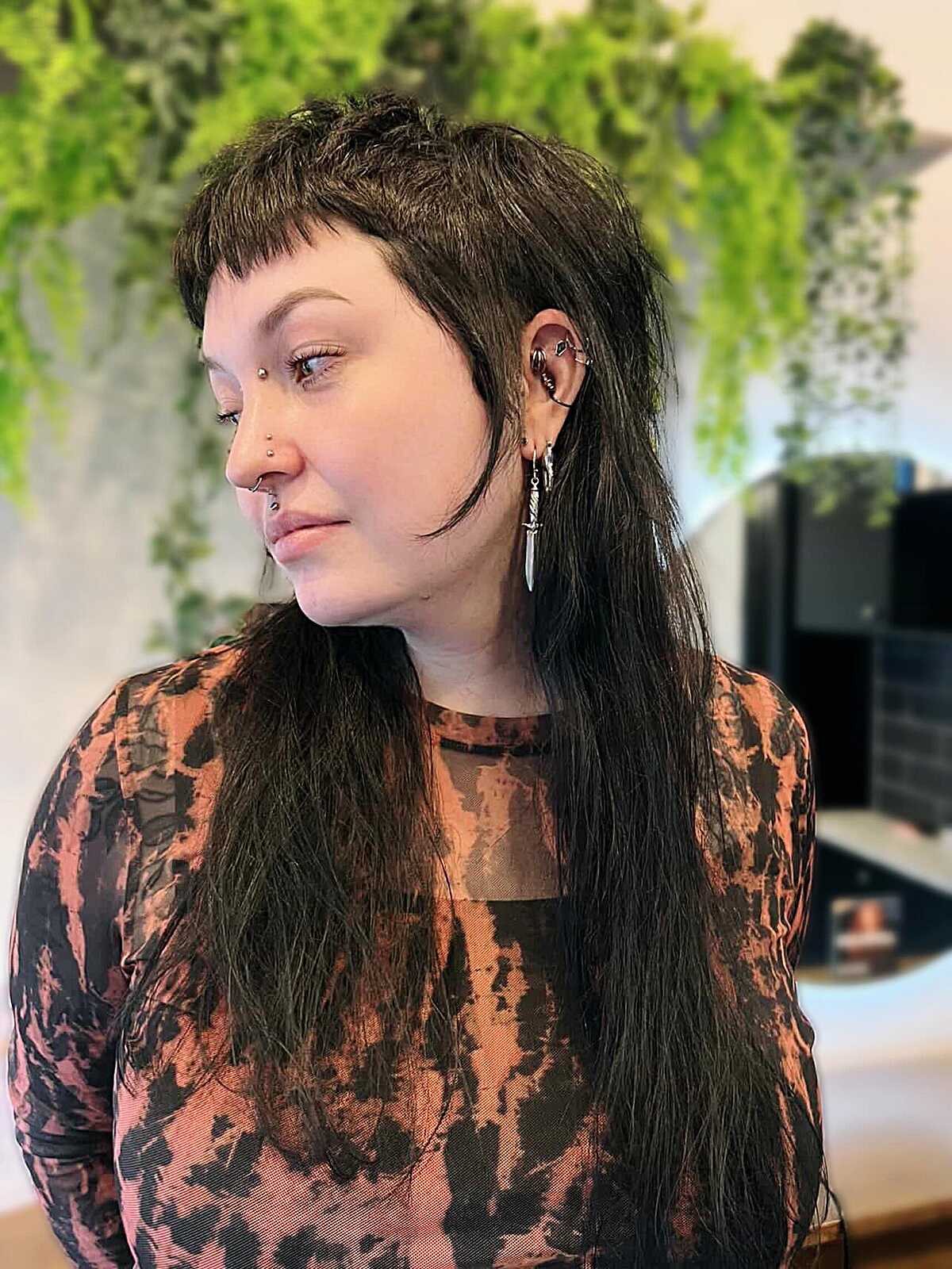 Dark textured mullet with short feathered micro bangs