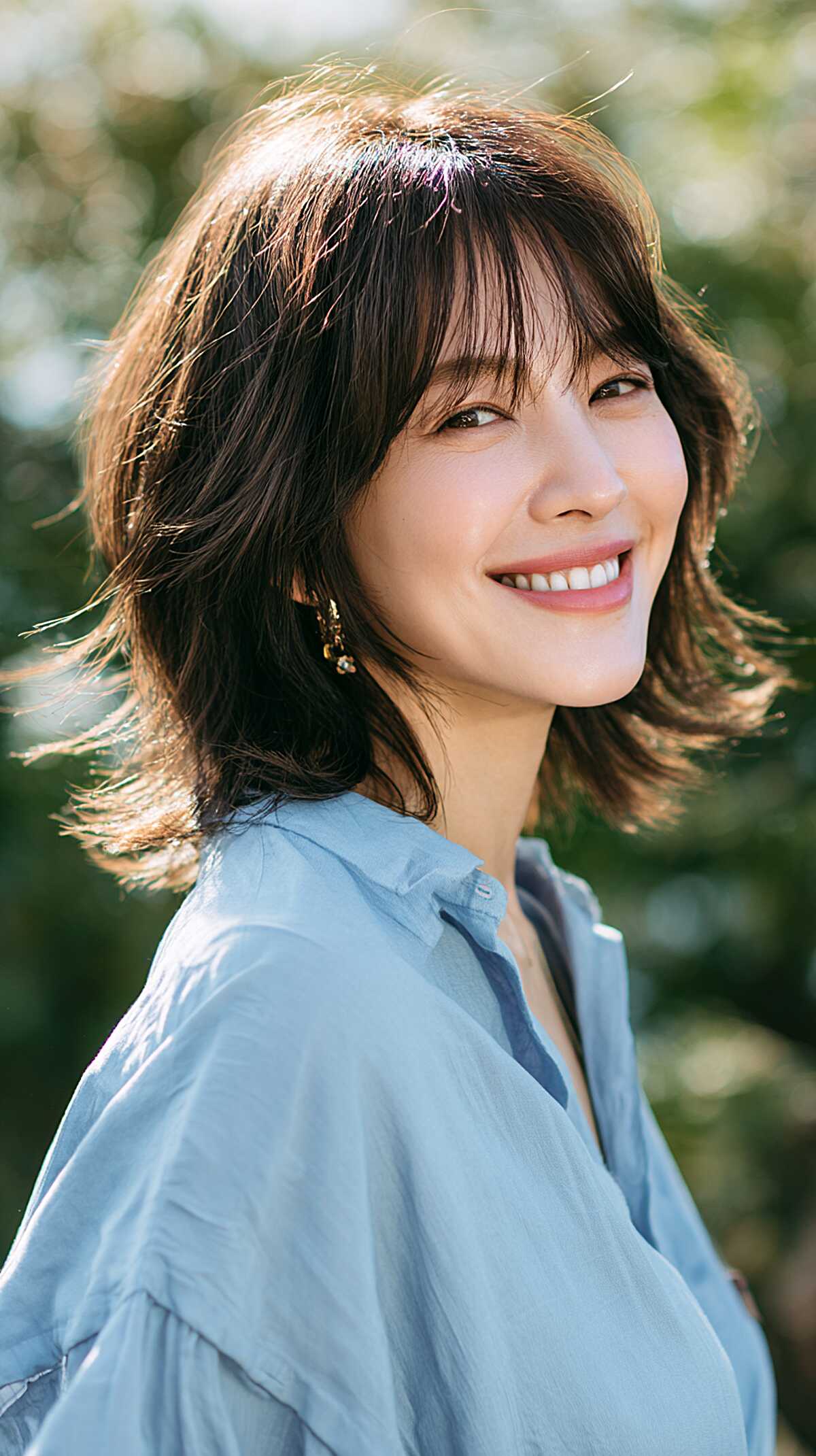 Warm Brunette Neck-Length Shag with Flipped Textured Ends and Wispy Fringe
