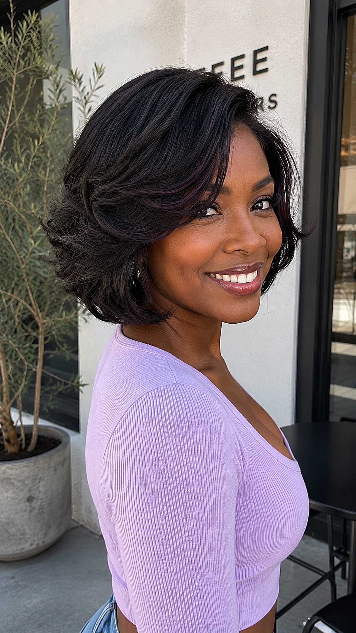 Bouncy Dark Jaw Bob with Layered Volume and Swooping Side Fringe
