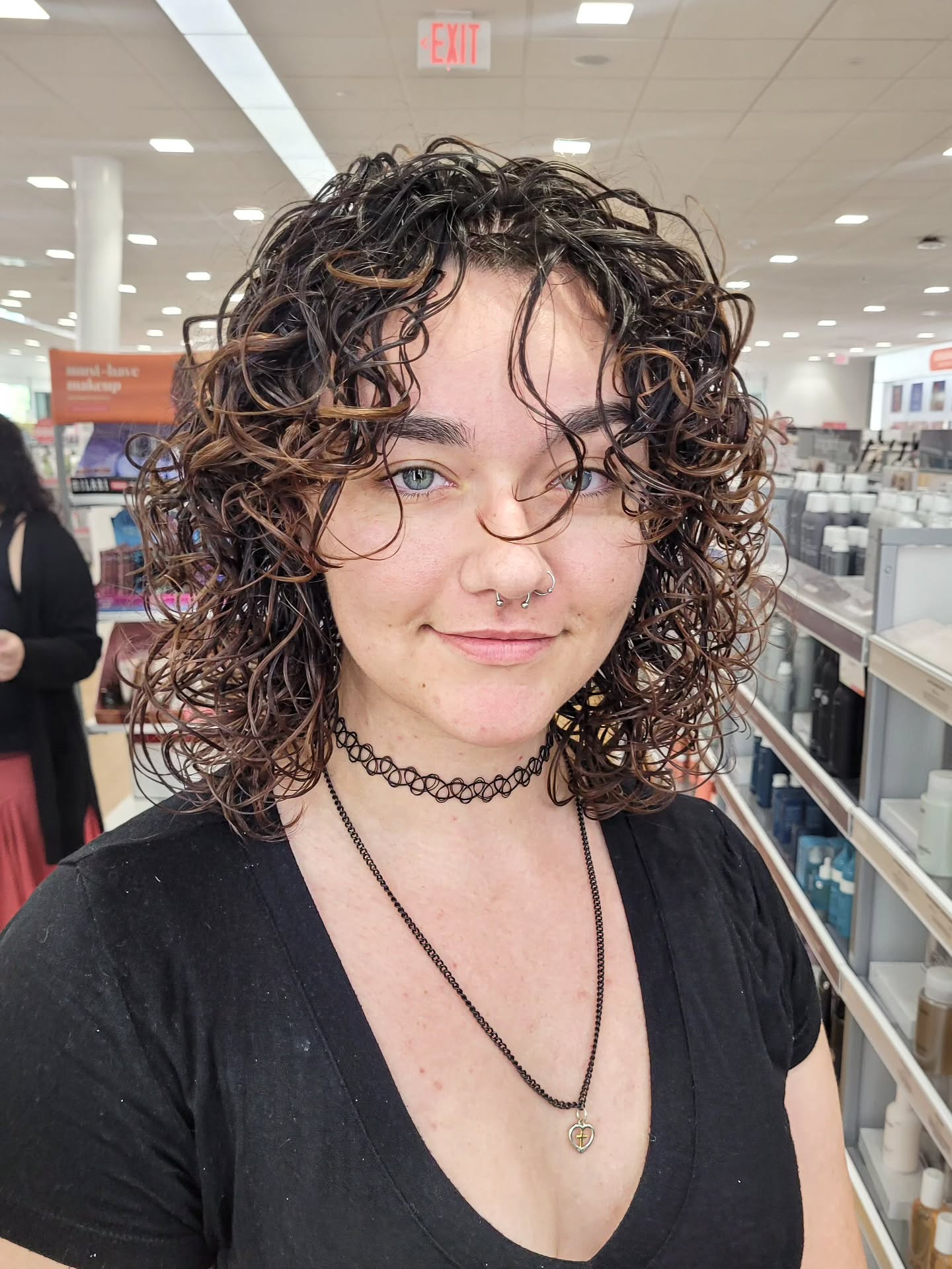 Chin-Length Curly Wolf with Warm Highlights and Messy Fringe