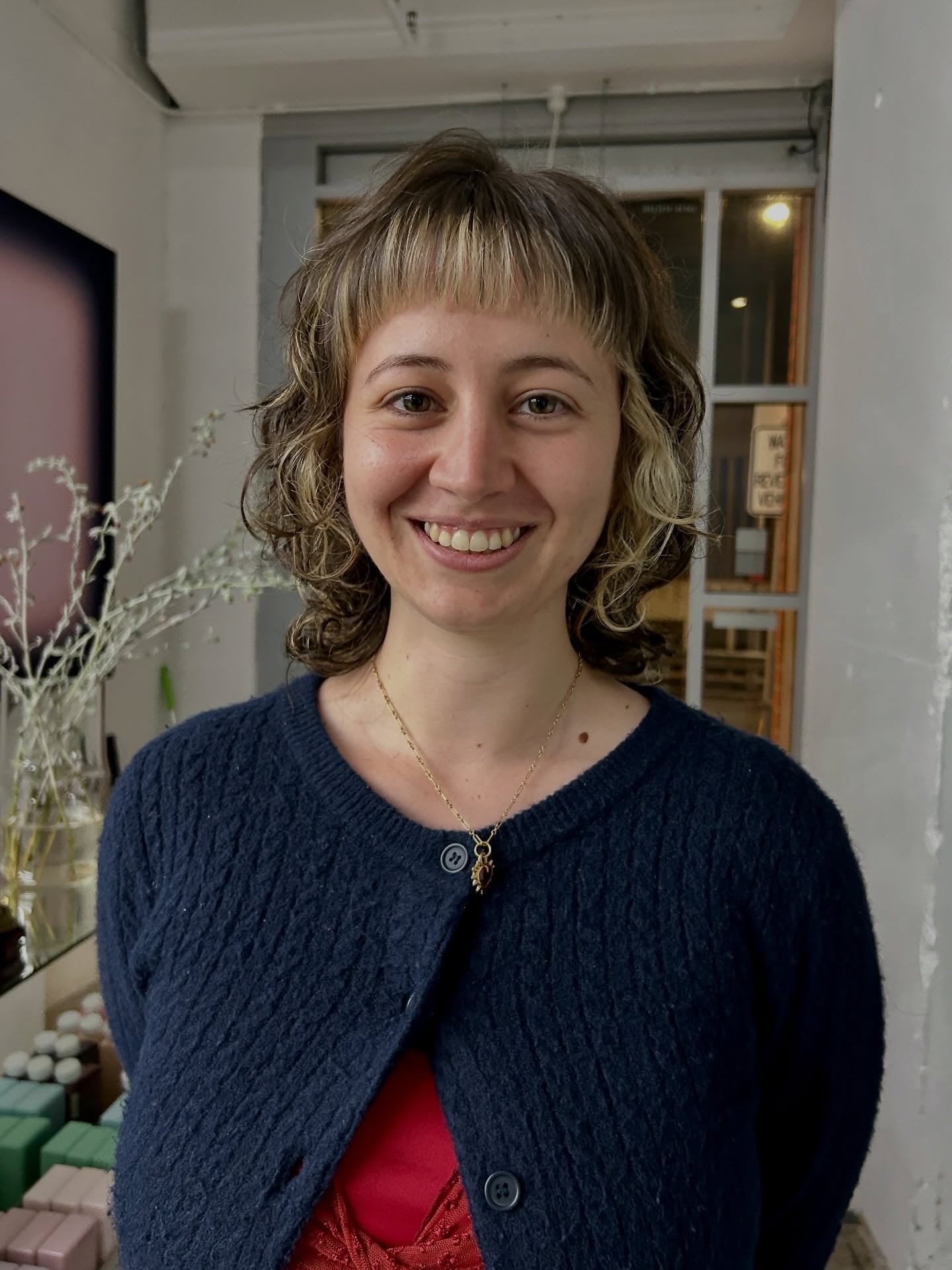 Choppy Blonde Curly Wolf with Straight-Cut Baby Bangs