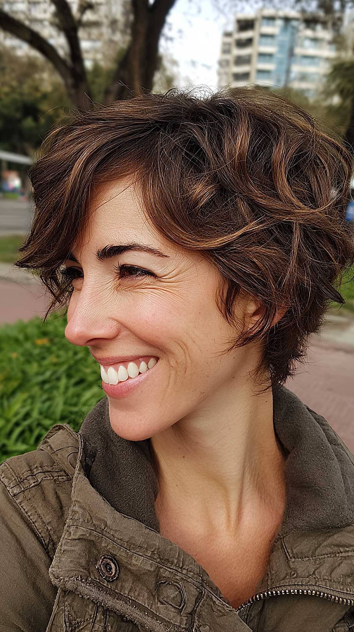 Curly Grown-Out Pixie with Warm Chestnut Highlights