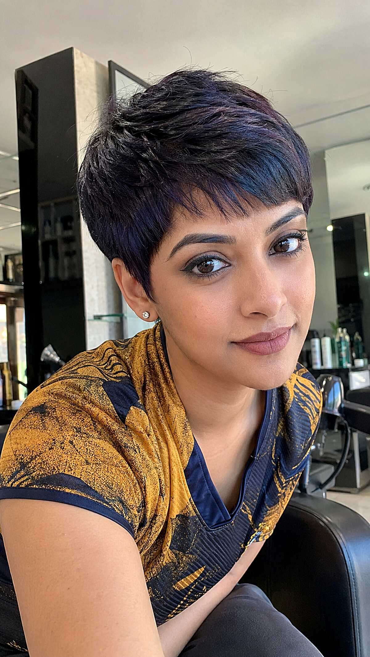 Deep violet-black micro pixie with swooping fringe