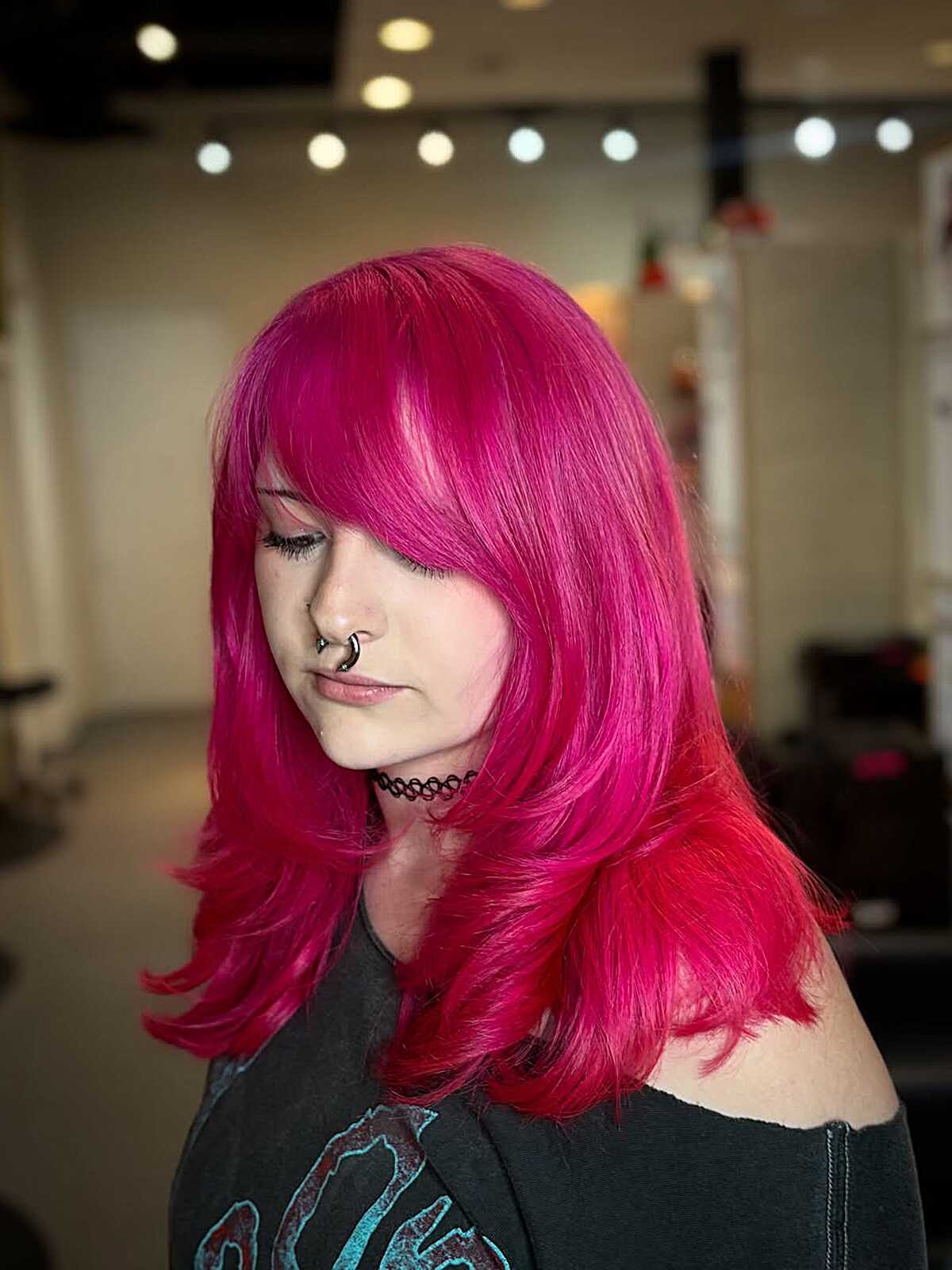 Bright hot pink medium blowout with full sweeping side bangs