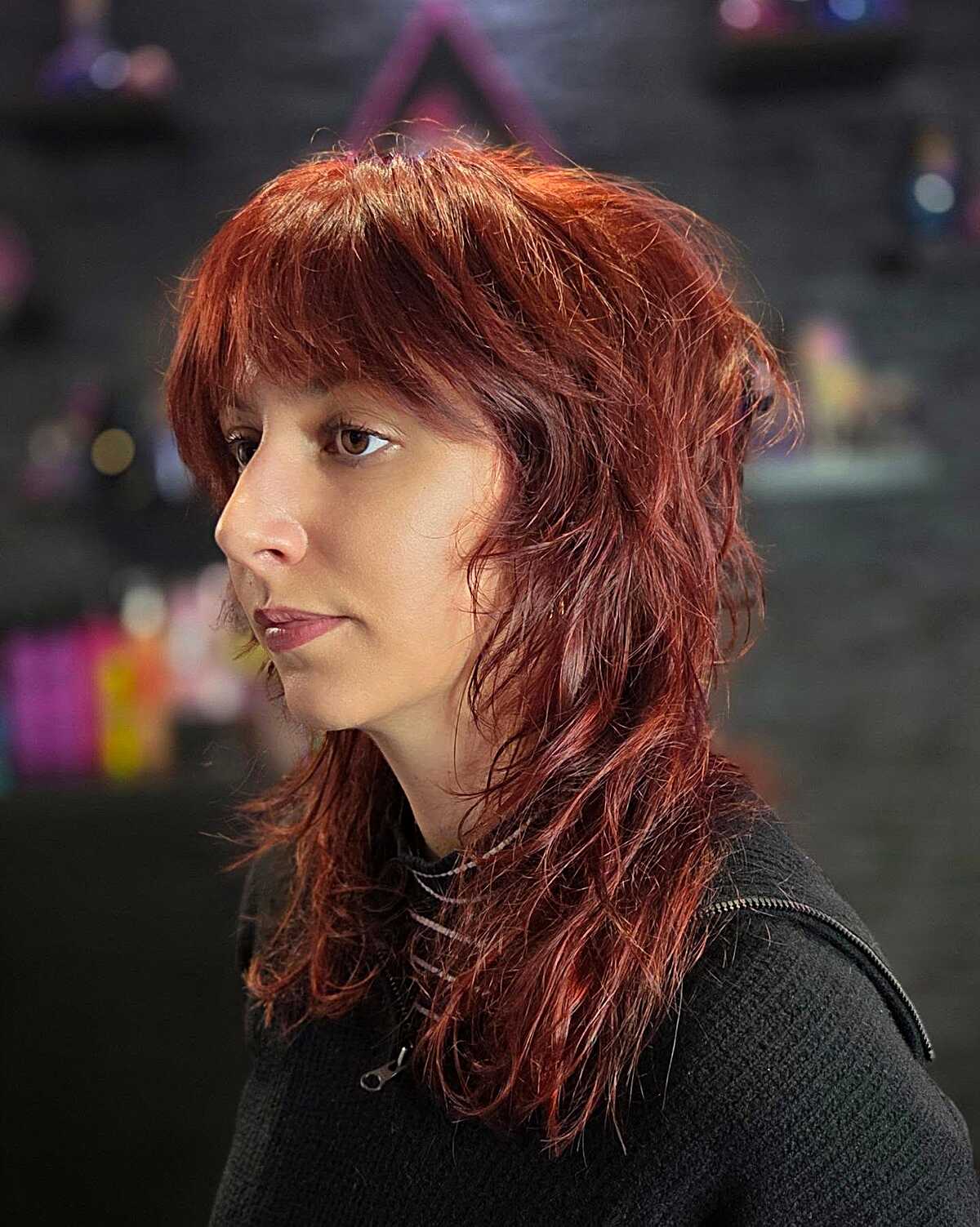Fiery red mid-length layered shag with textured fringe