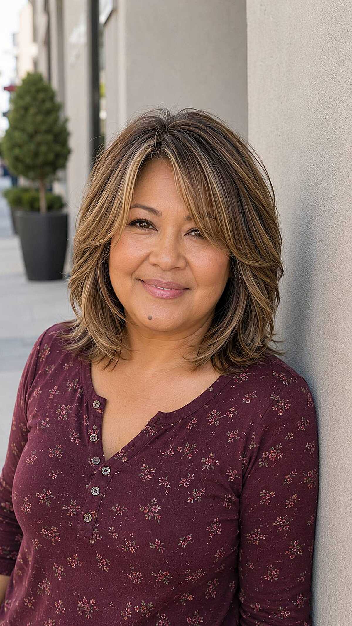 Medium-length layered shag with honey blonde highlights