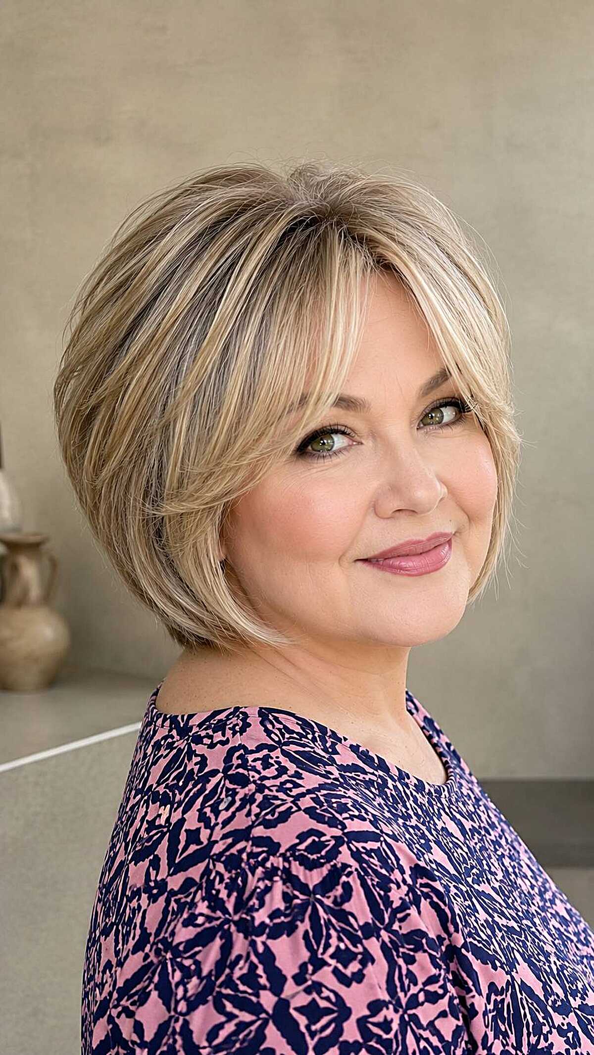 Layered blonde chin-length bob with darker lowlights