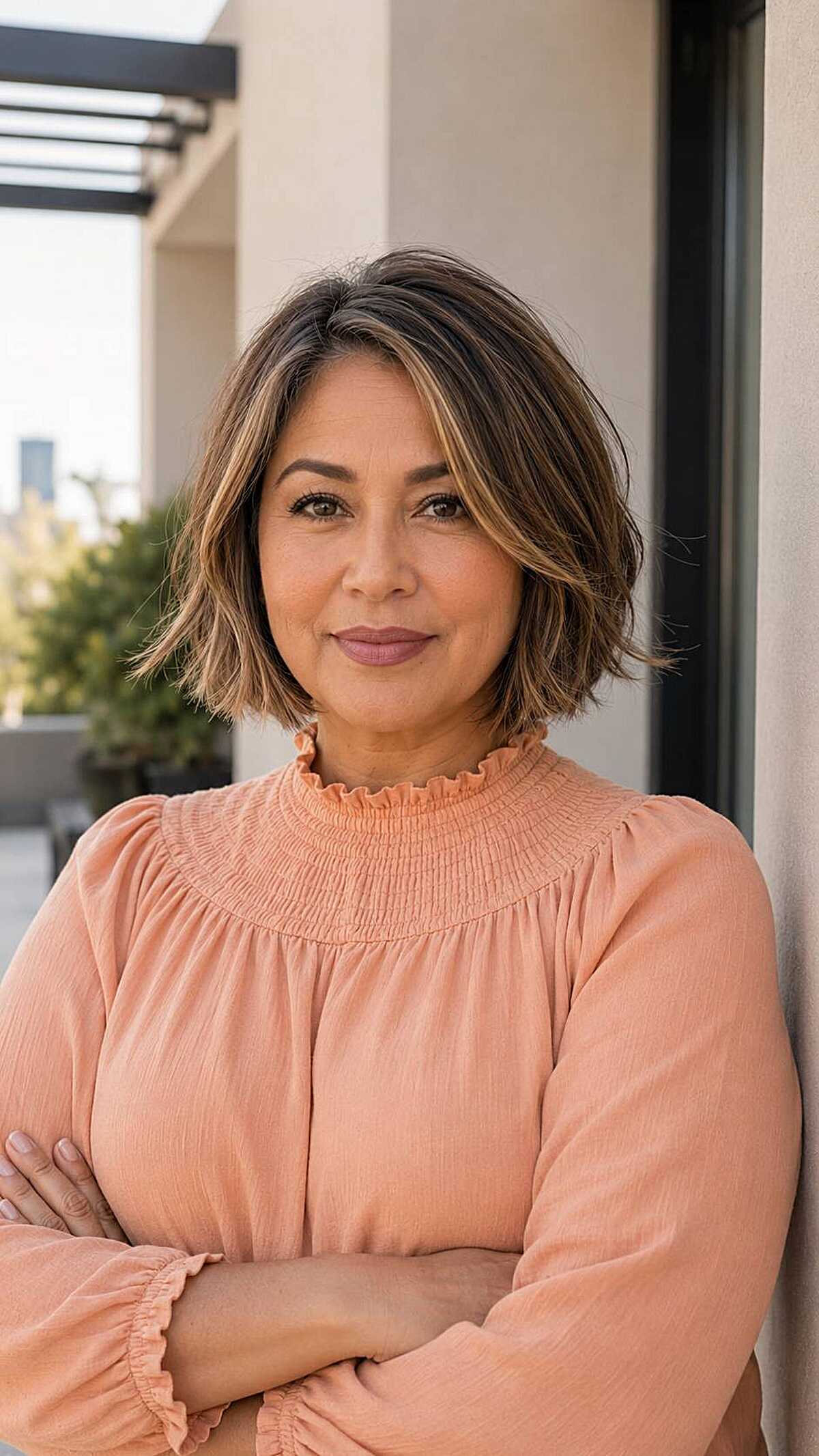 Textured choppy chin-length bob with caramel highlights