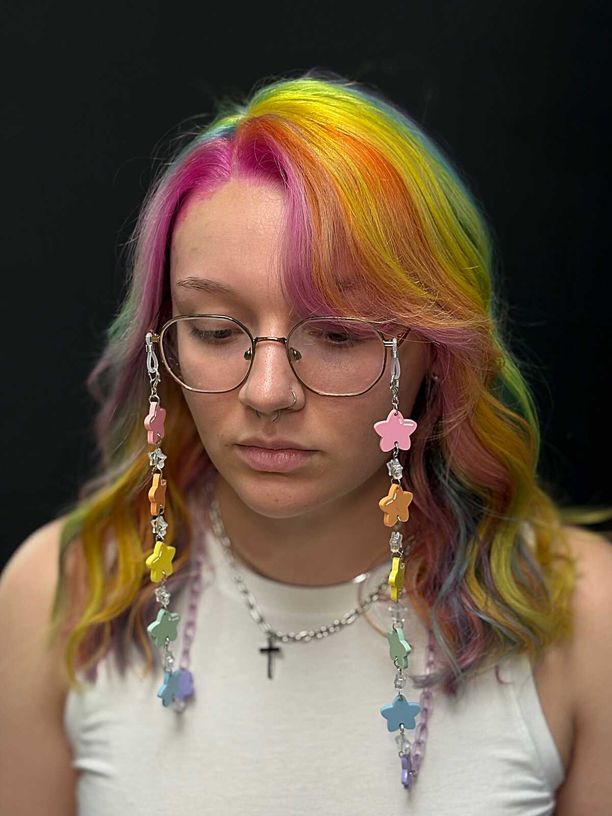 Rainbow wavy hair with pink, yellow, and green side bangs