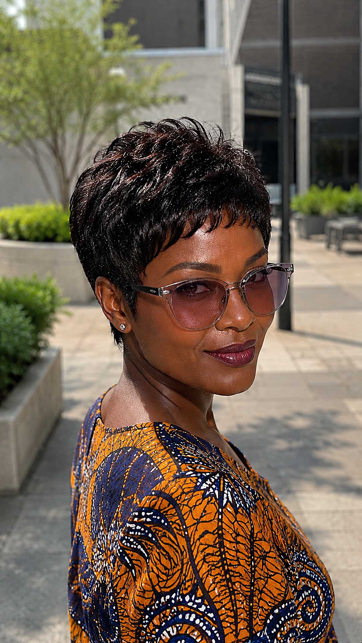 Glossy black layered micro pixie with soft waves