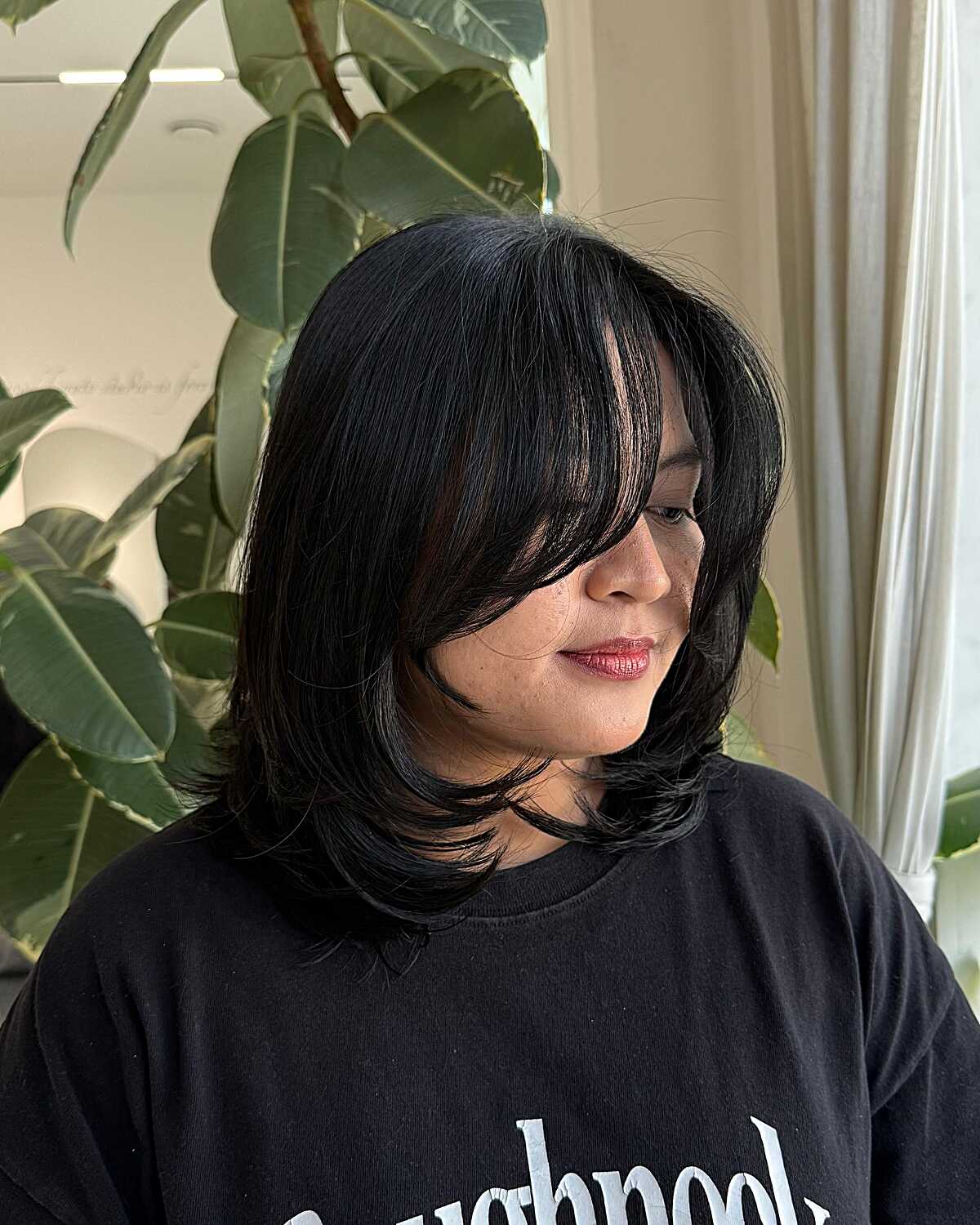 Jet black mid-length blowout with flipped ends