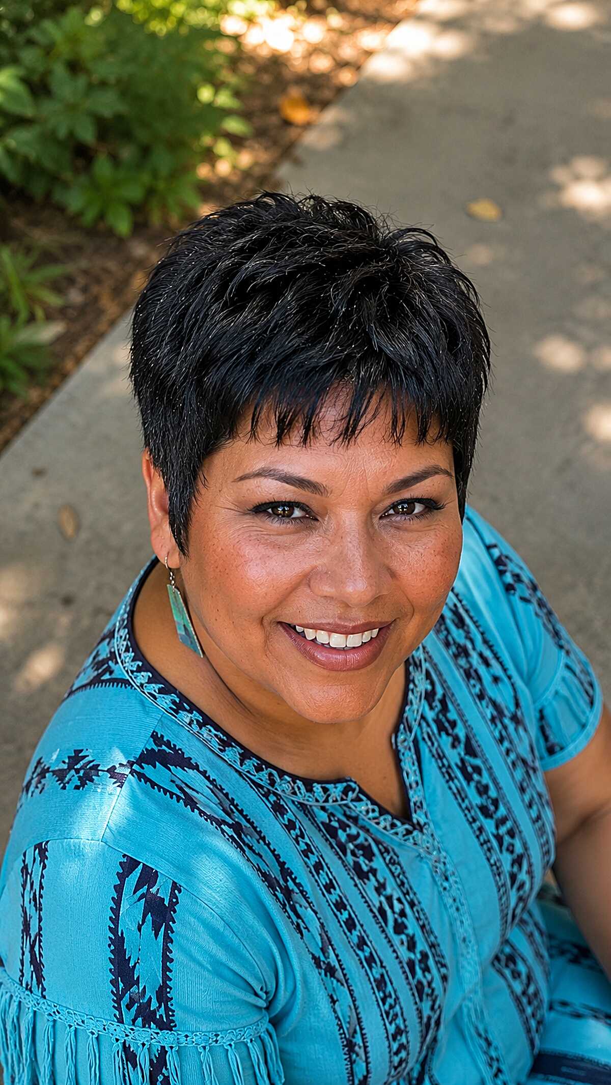 Jet black spiky micro pixie with choppy texture