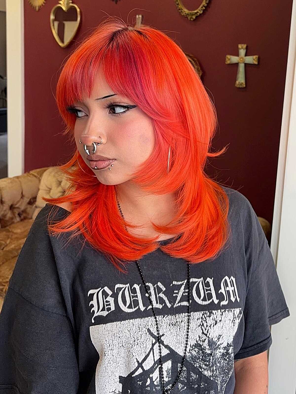 Neon orange medium hair with pink roots and curtain side bang
