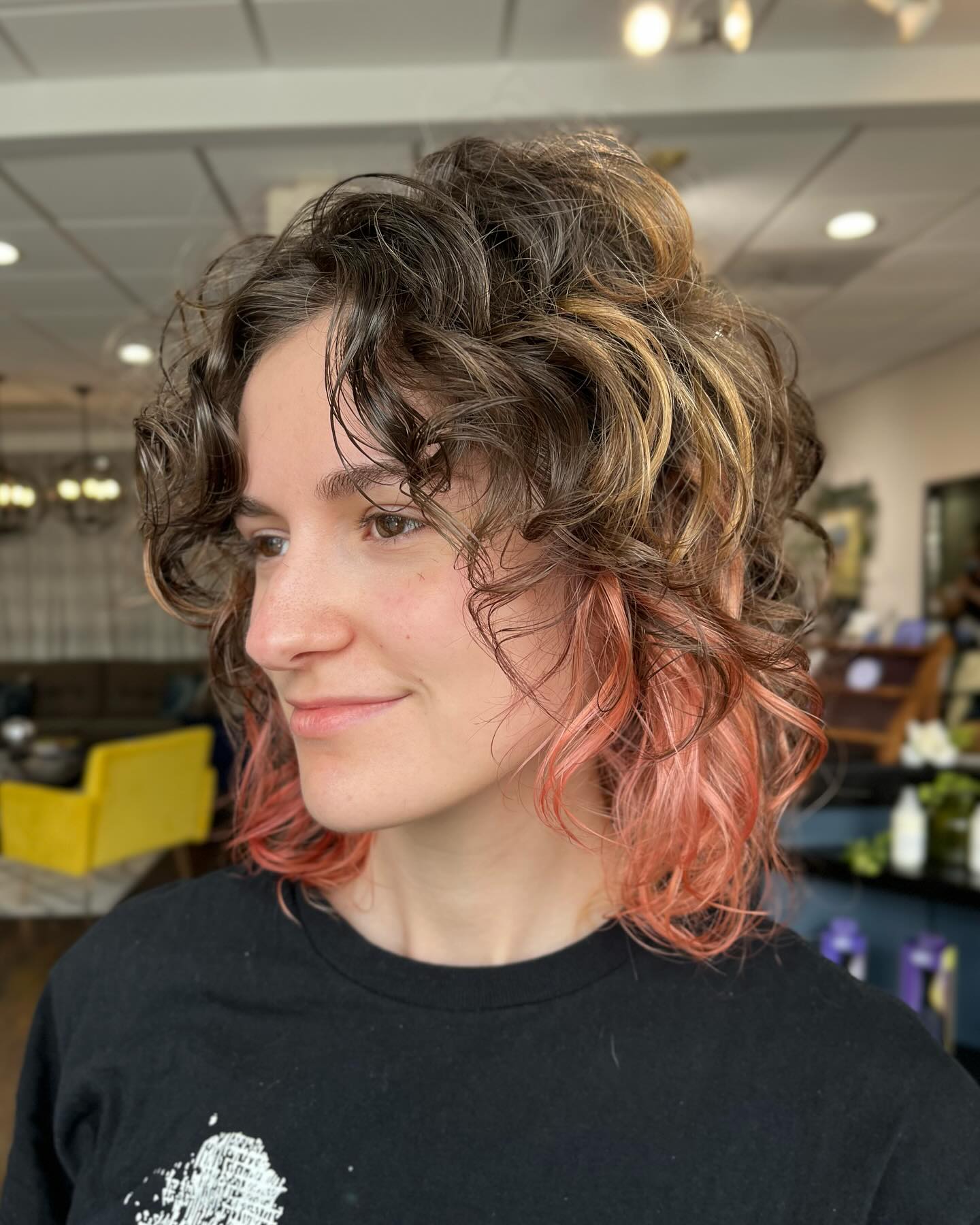 Peachy Pink Underlayer on a Chin-Length Curly Wolf