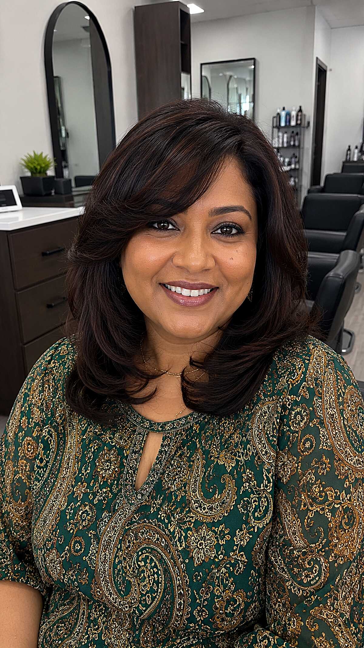 Dark polished shoulder-length blowout with flipped ends