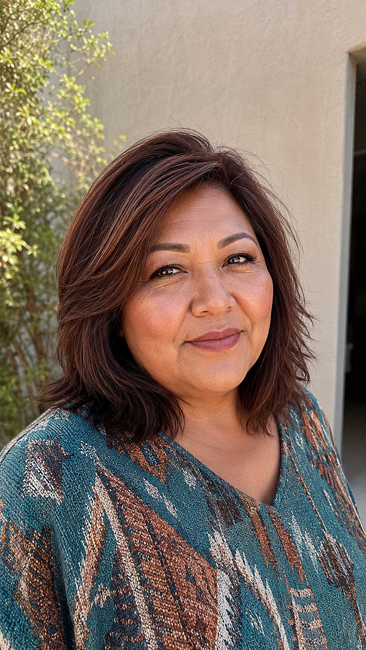 Rich auburn layered lob with flipped ends
