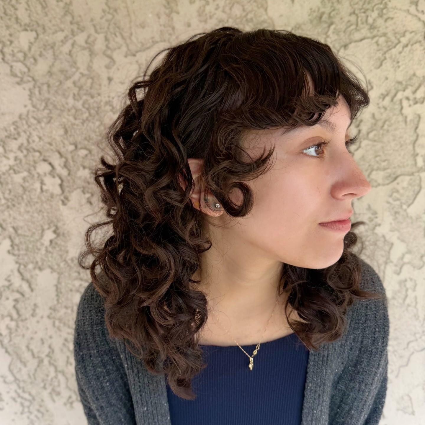 Rich Brunette Curly Wolf with Short Textured Fringe