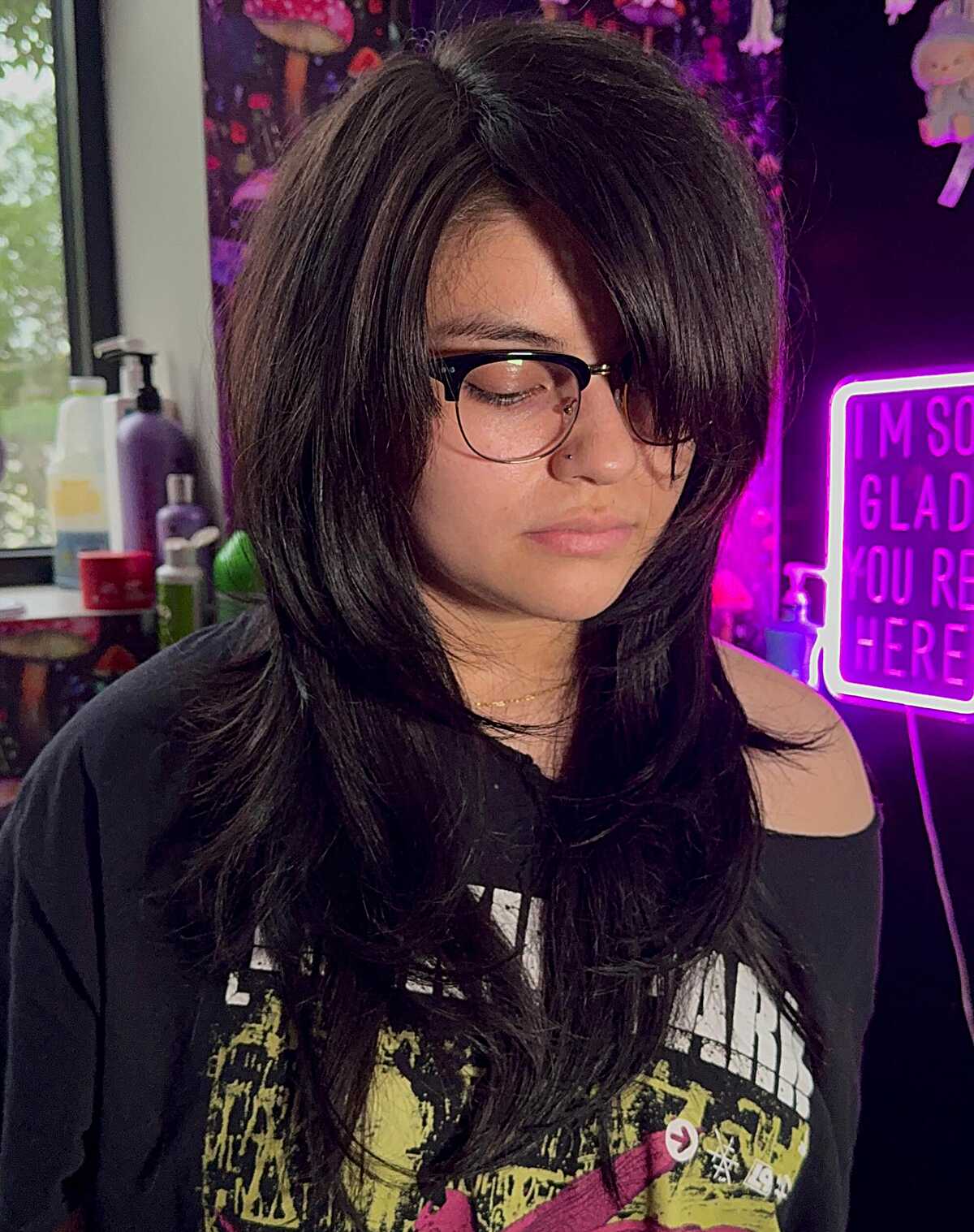 Dark brown choppy shag with heavy side bangs and glasses