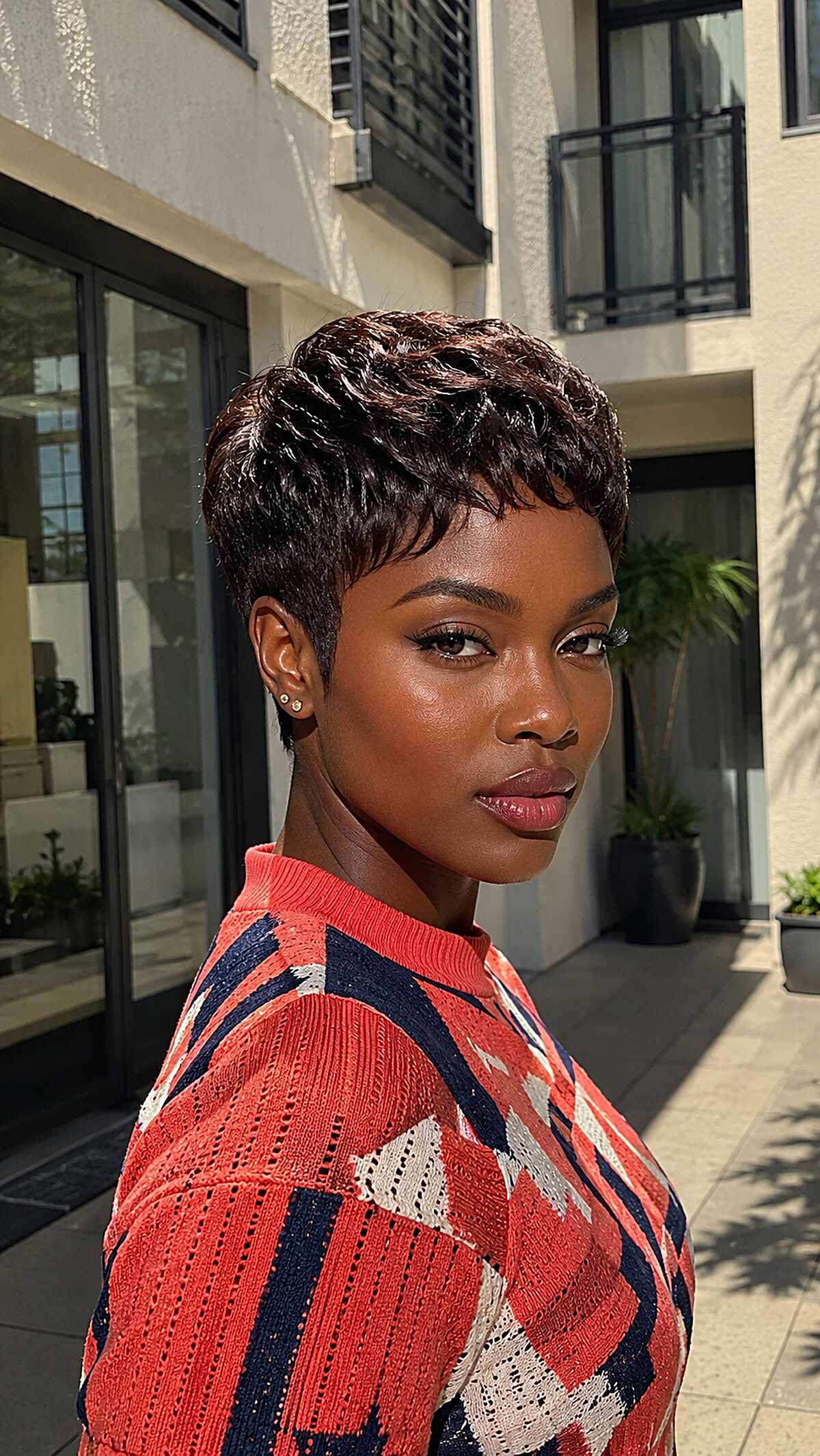Sculpted dark chocolate micro pixie with defined waves