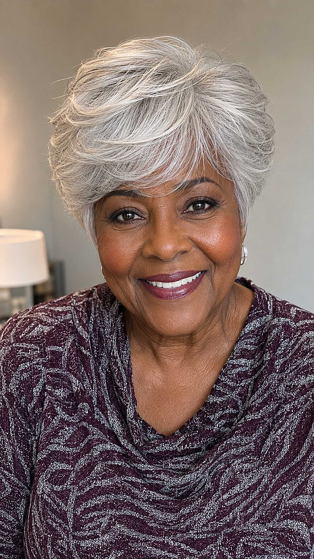 Silver feathered pixie cut with volume and swept bangs