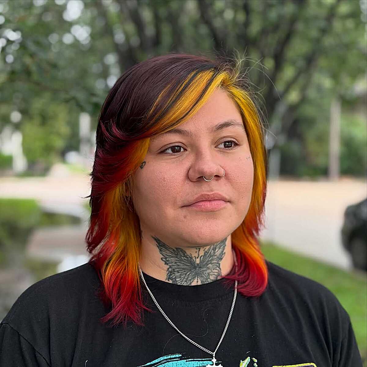 Mullet shag with yellow, orange, and red sunset streaks