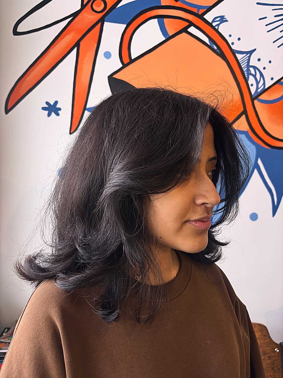 Black feathered mid-length blowout with volume