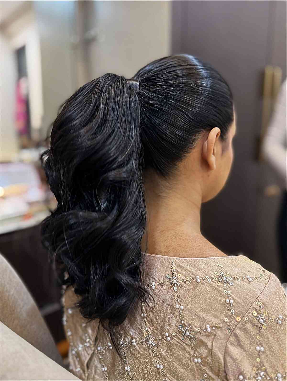 Sleek High Ponytail with Soft Waves