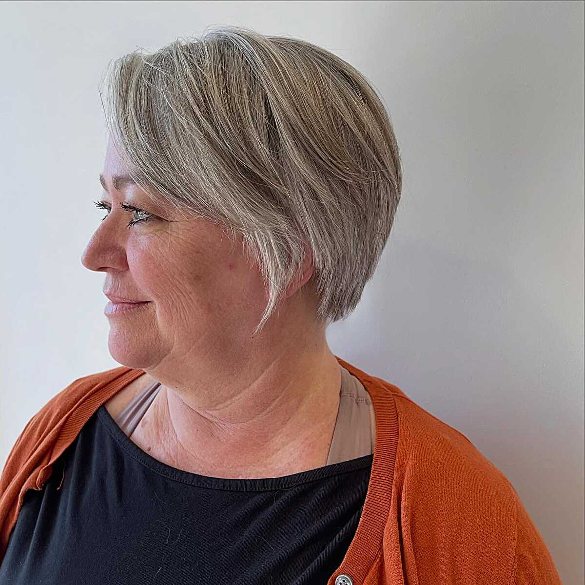 Ash blonde sculpted bixie with tapered nape and volume
