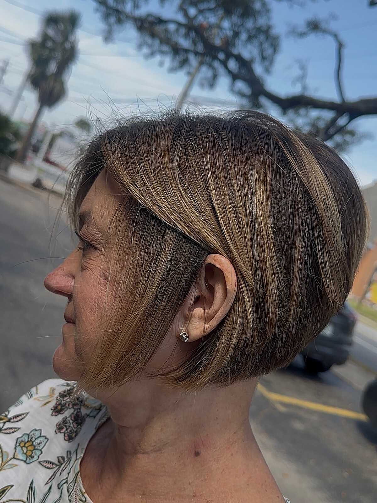Brunette ear-length bixie with caramel highlights