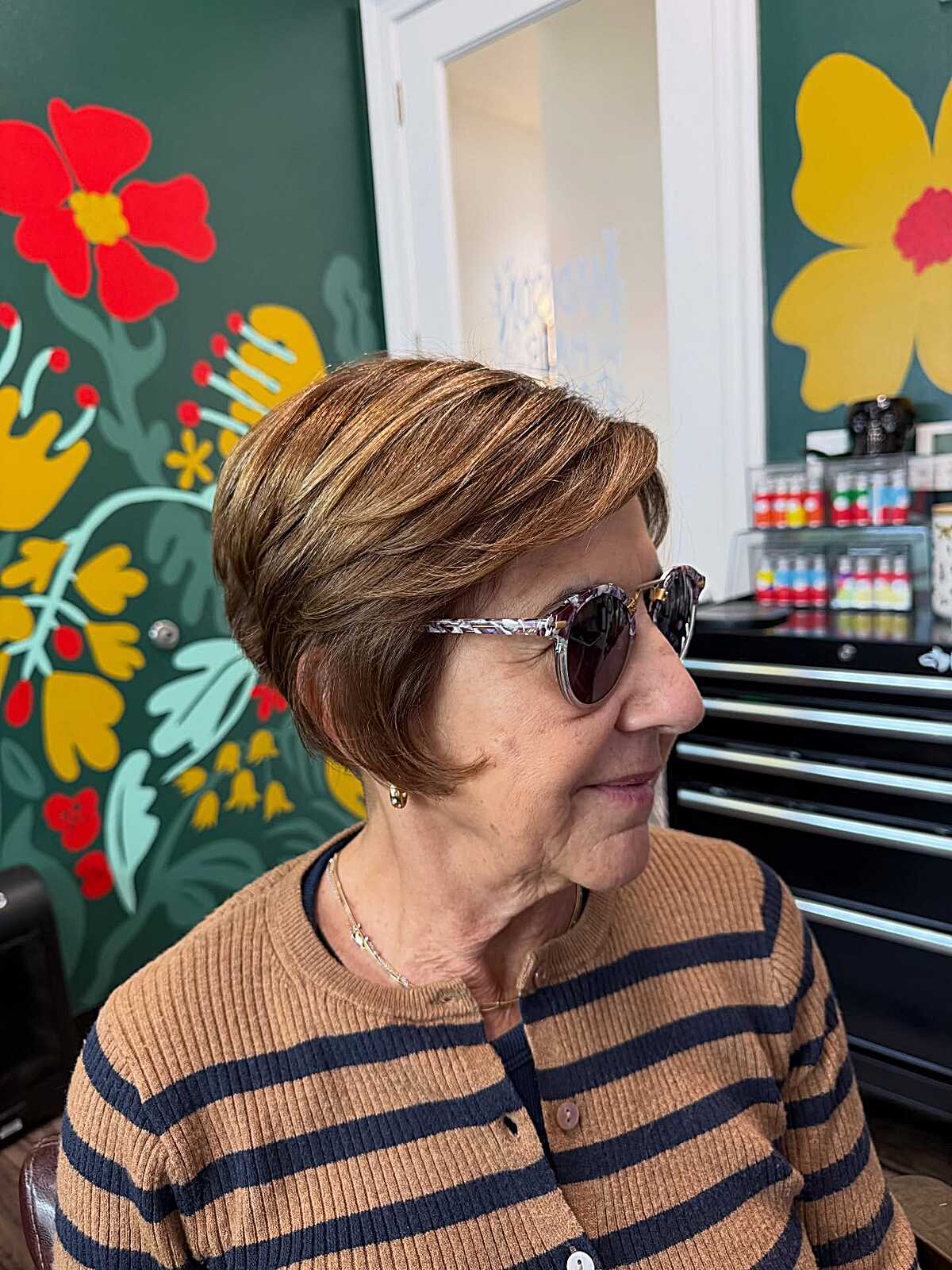 Caramel highlighted bixie swept back with sunglasses