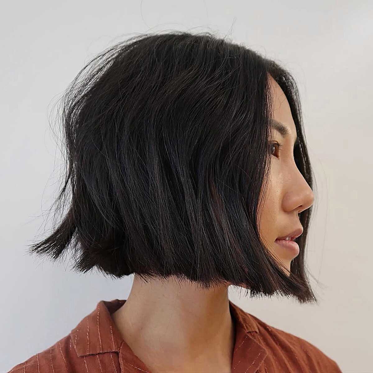 Chin-length black bob with textured ends and volume