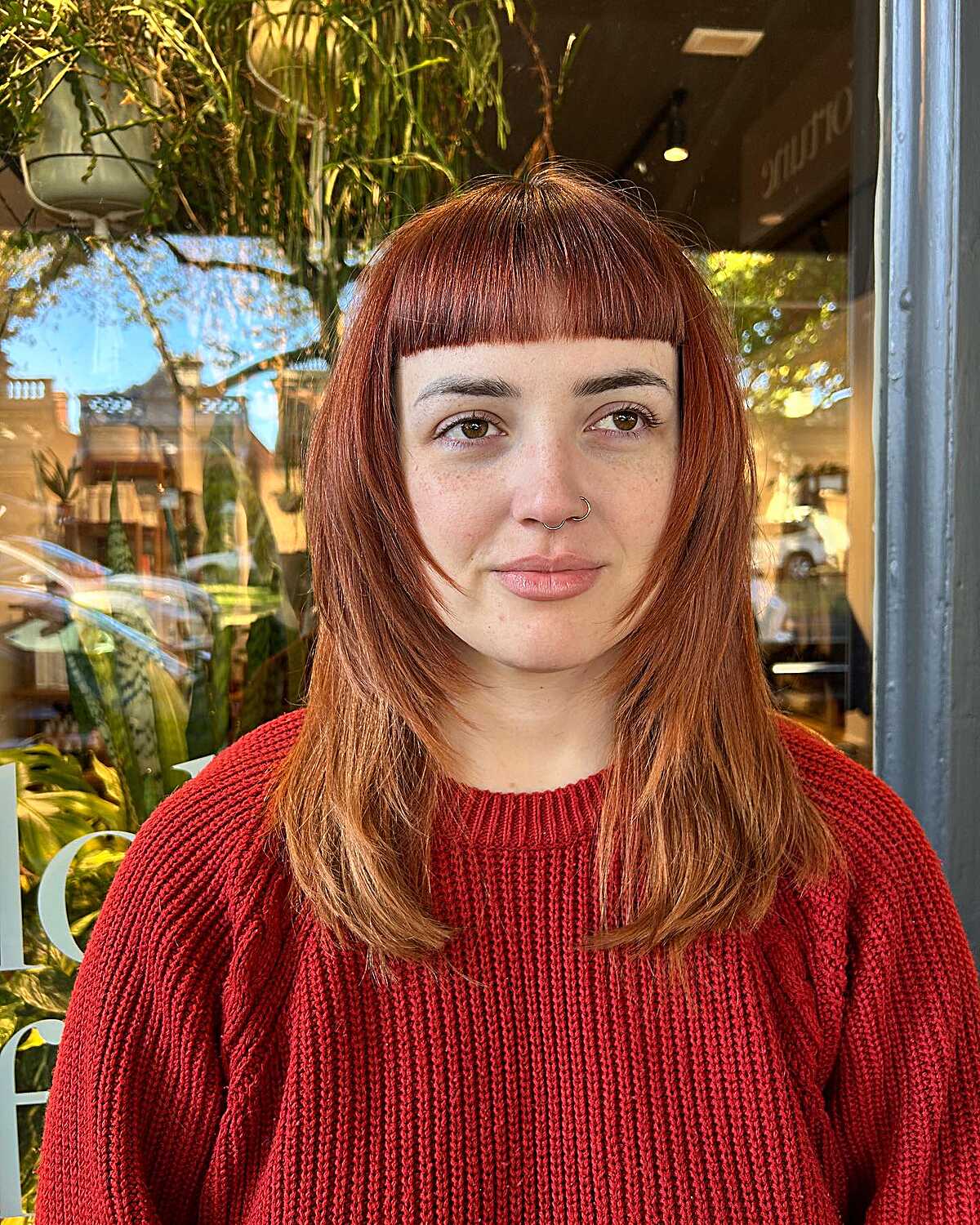 Copper red lob with short blunt baby bangs